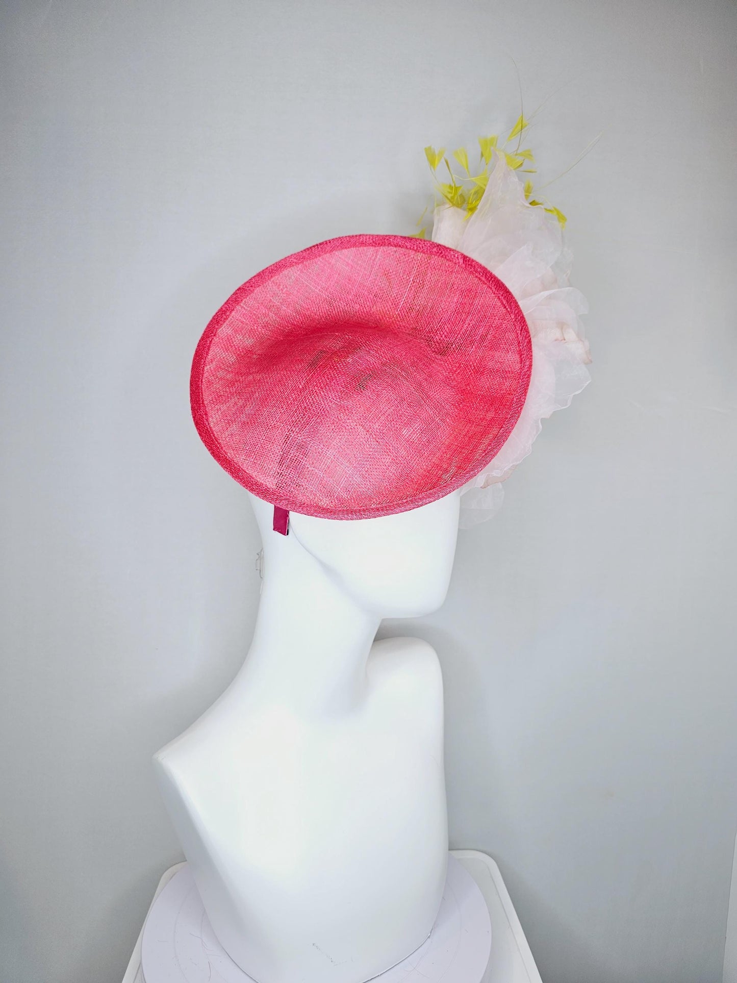 kentucky derby hat fascinator raspberry pink sinamay saucer with large light pale pink organza satin rose and yellow branching feathers