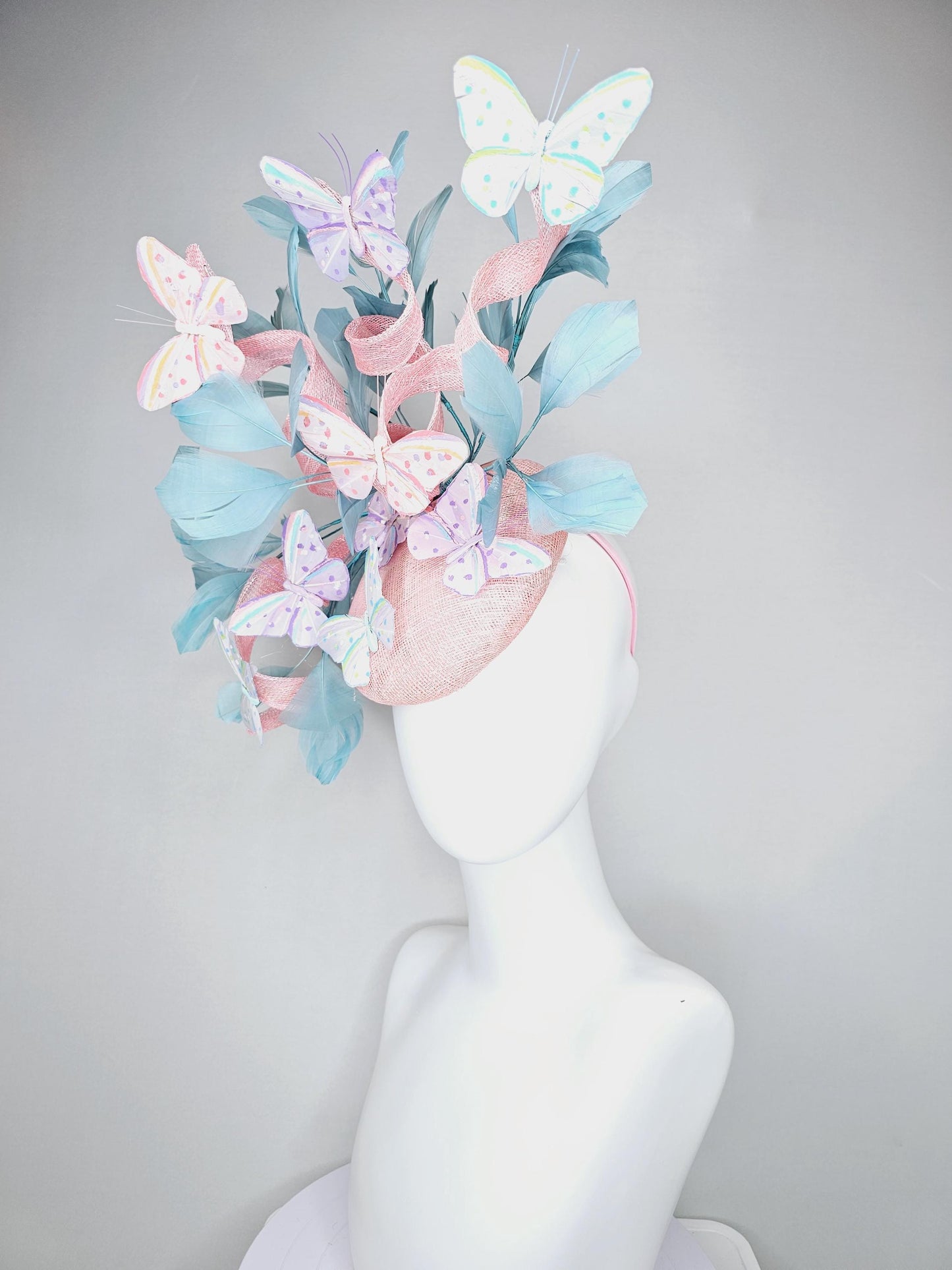 kentucky derby hat fascinator light baby pink sinamay with curls,light blue branching feathers,ivory,pink,purple,yellow,blue butterflies