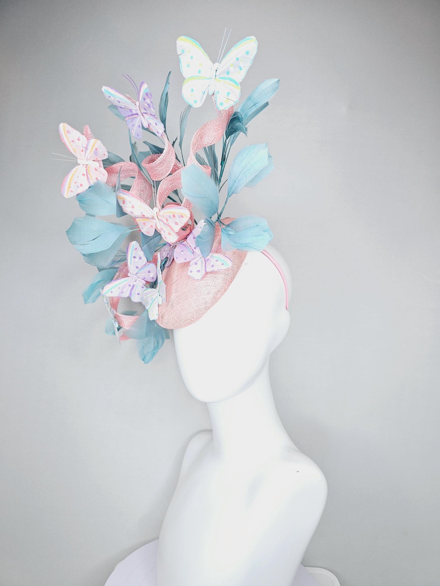 kentucky derby hat fascinator light baby pink sinamay with curls,light blue branching feathers,ivory,pink,purple,yellow,blue butterflies