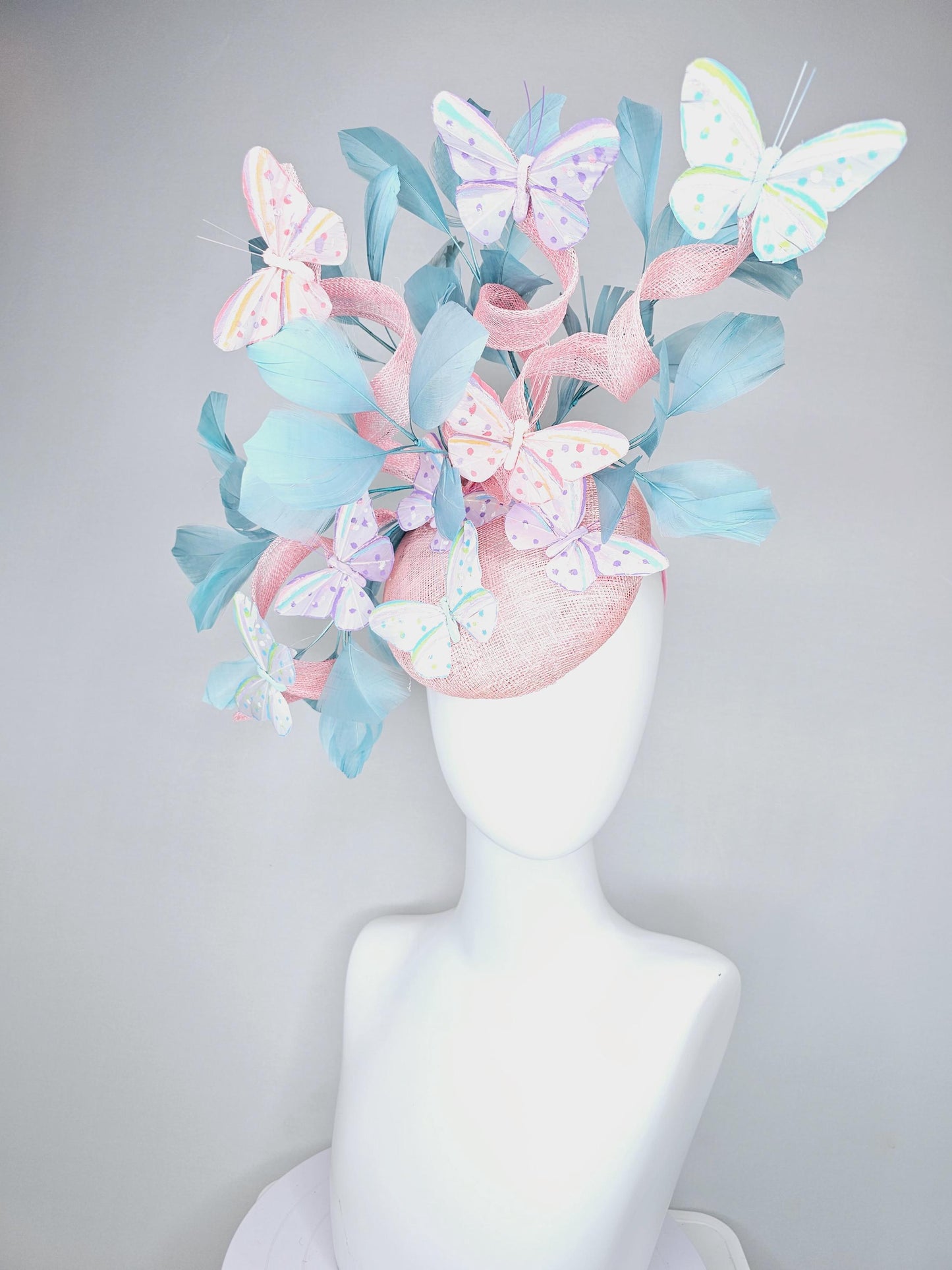 kentucky derby hat fascinator light baby pink sinamay with curls,light blue branching feathers,ivory,pink,purple,yellow,blue butterflies