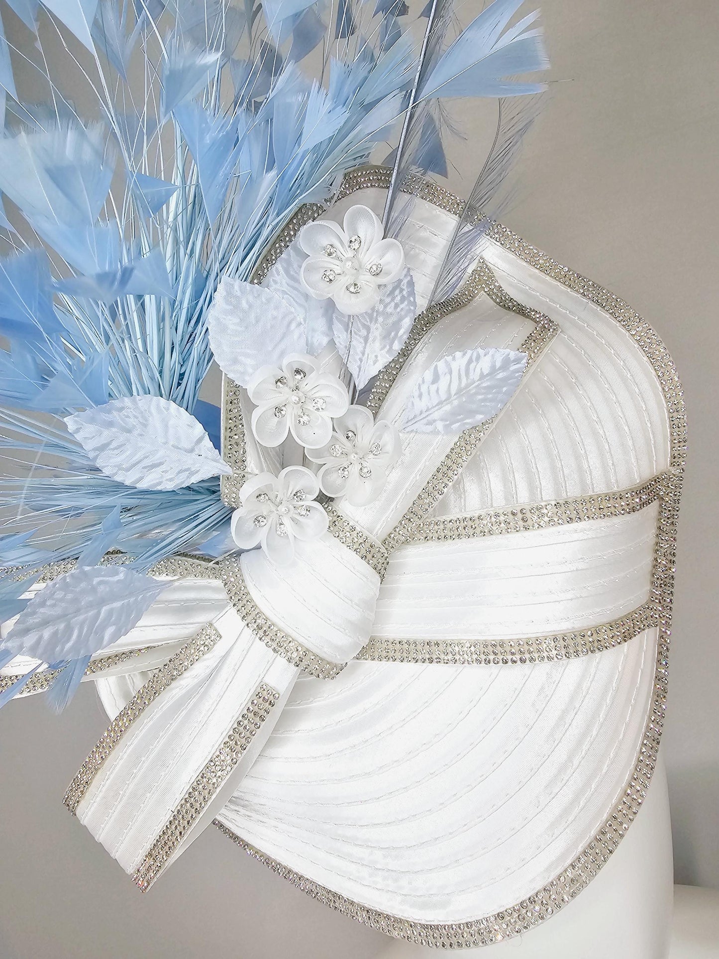 kentucky derby hat fascinator white satin saucer crystal rhinestone beading,large crystal beaded bow,light blue feathers,white silk flowers