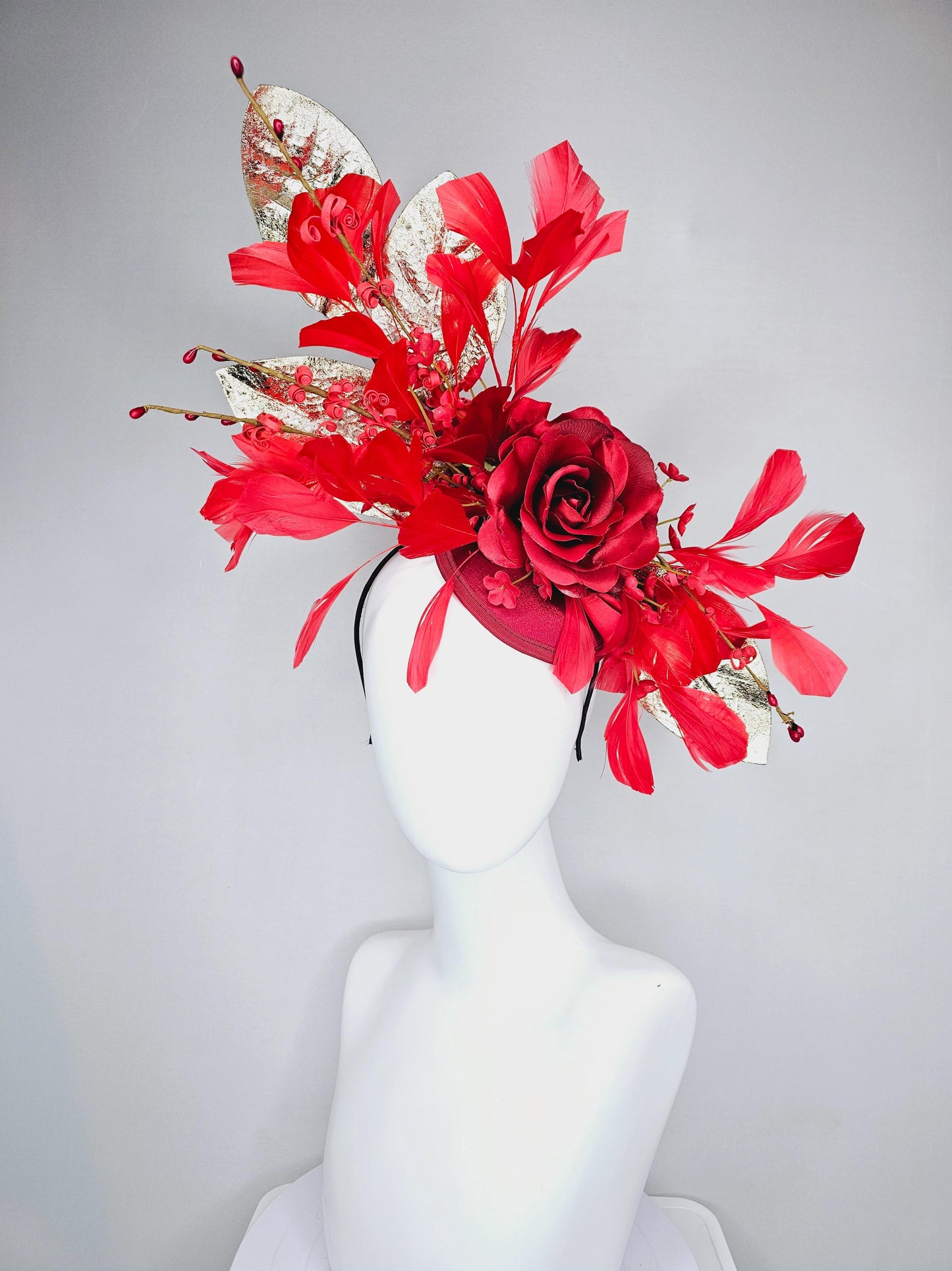 kentucky derby hat fascinator burgundy red satin with burgundy red satin rose flower, cherry red branching feathers, gold leaves and stems