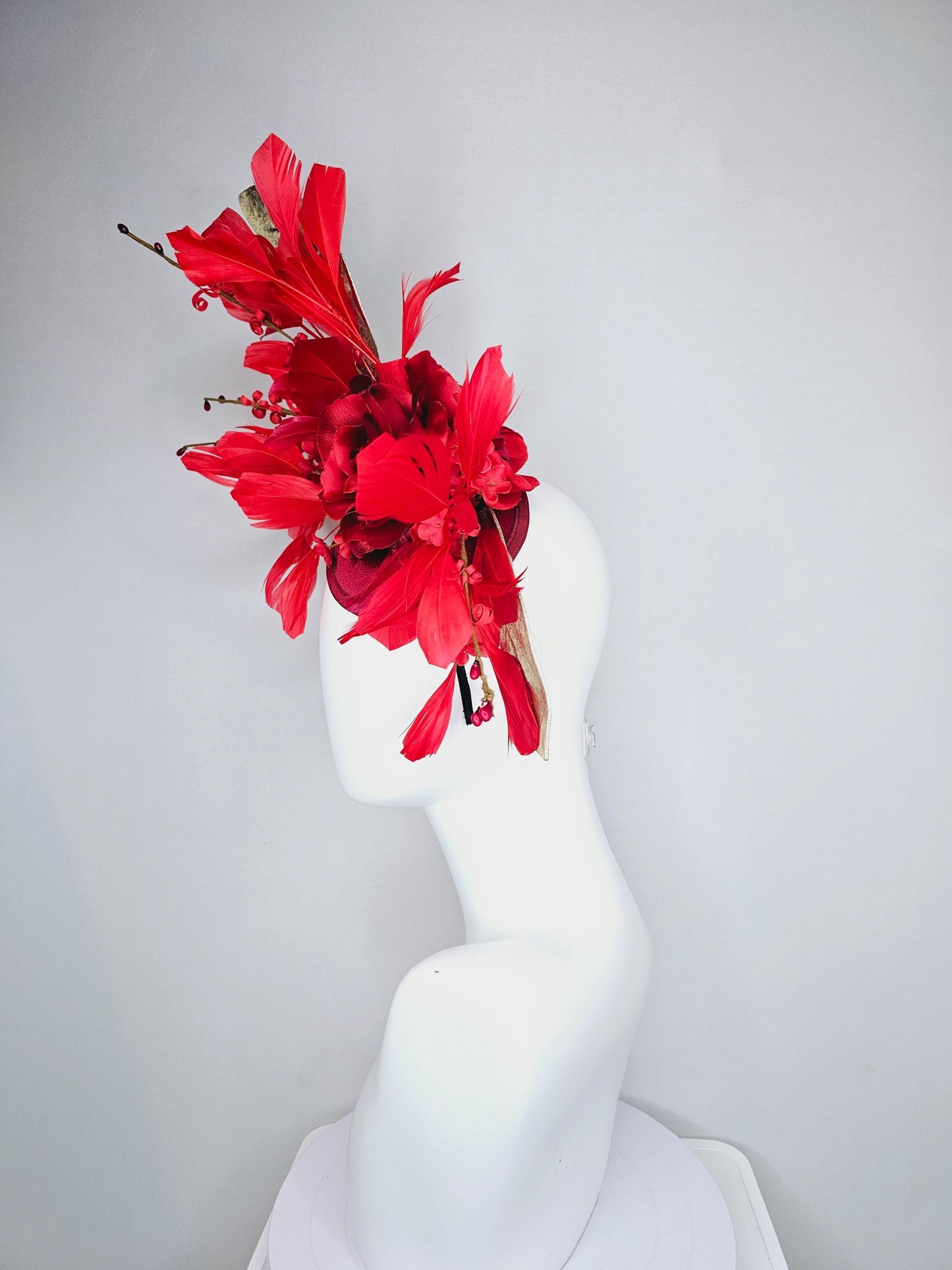 kentucky derby hat fascinator burgundy red satin with burgundy red satin rose flower, cherry red branching feathers, gold leaves and stems