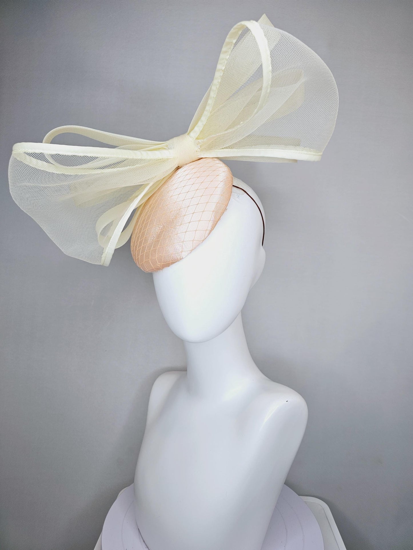 kentucky derby hat fascinator light pink satin with netting and large mesh neutral beige ivory bow