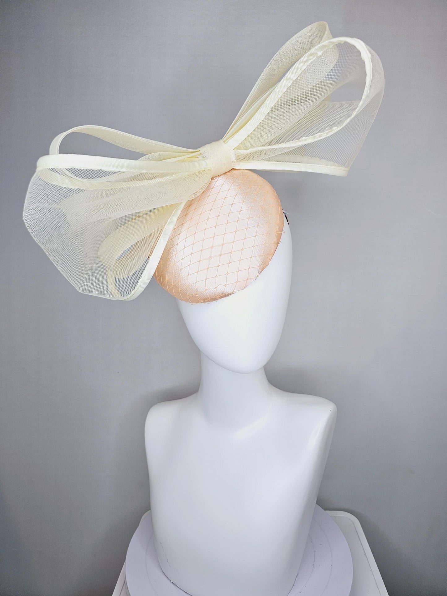 kentucky derby hat fascinator light pink satin with netting and large mesh neutral beige ivory bow