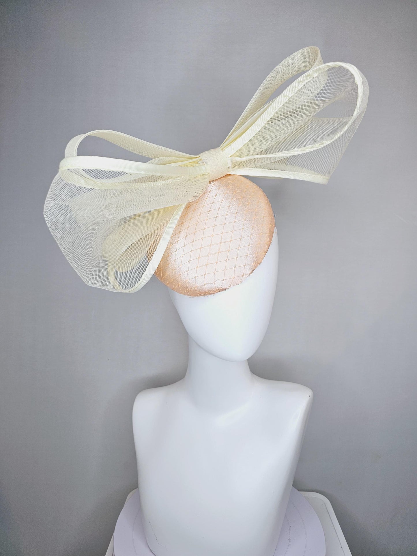 kentucky derby hat fascinator light pink satin with netting and large mesh neutral beige ivory bow