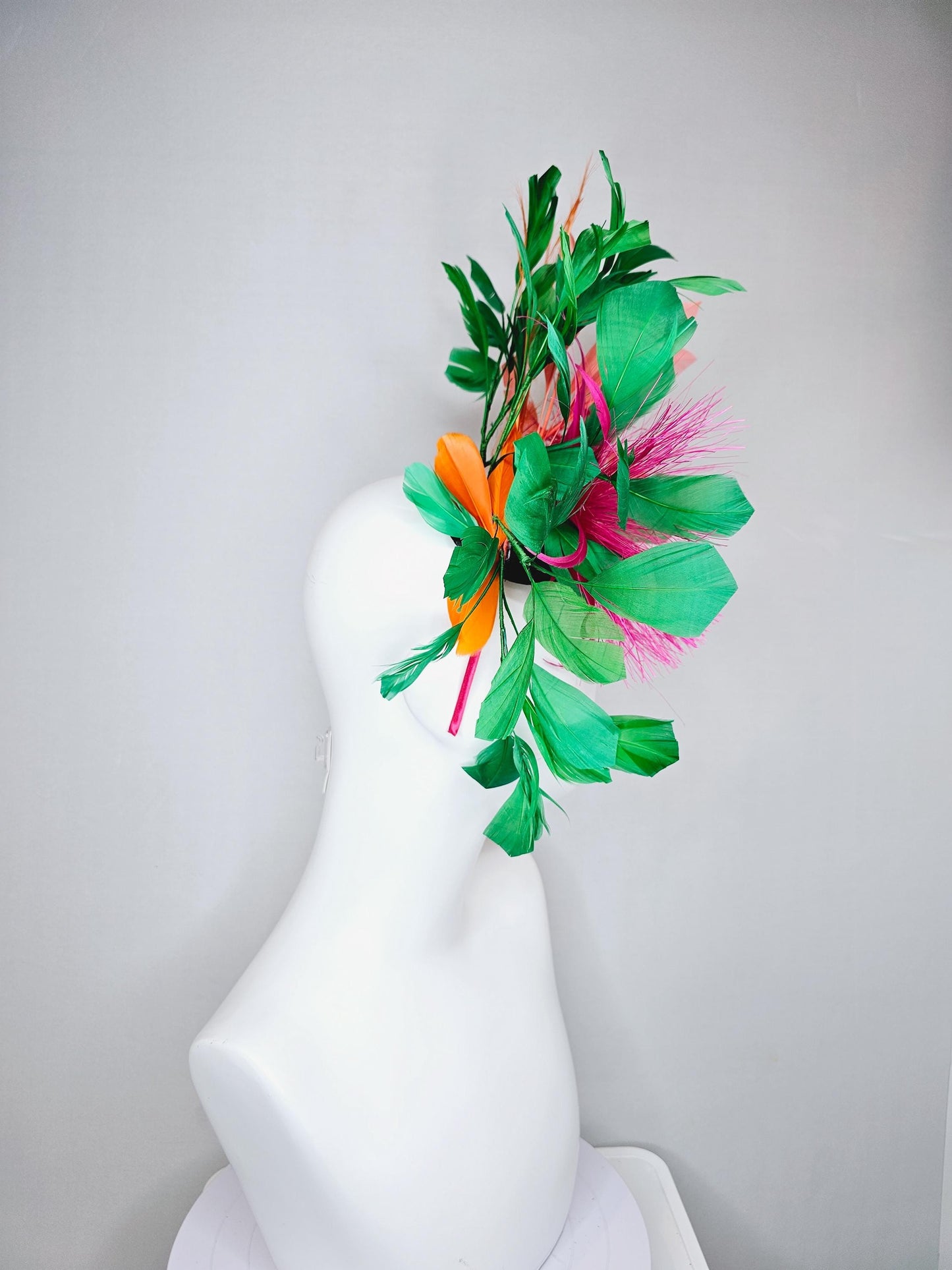 kentucky derby hat fascinator pink spiky feather flower, light orange peach, emerald green branching feathers and light peach feather curls