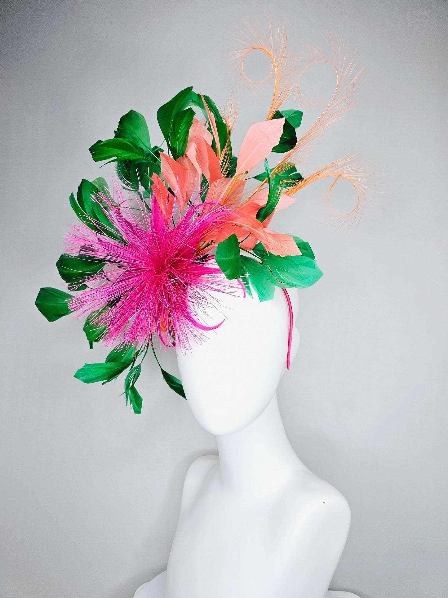 kentucky derby hat fascinator pink spiky feather flower, light orange peach, emerald green branching feathers and light peach feather curls