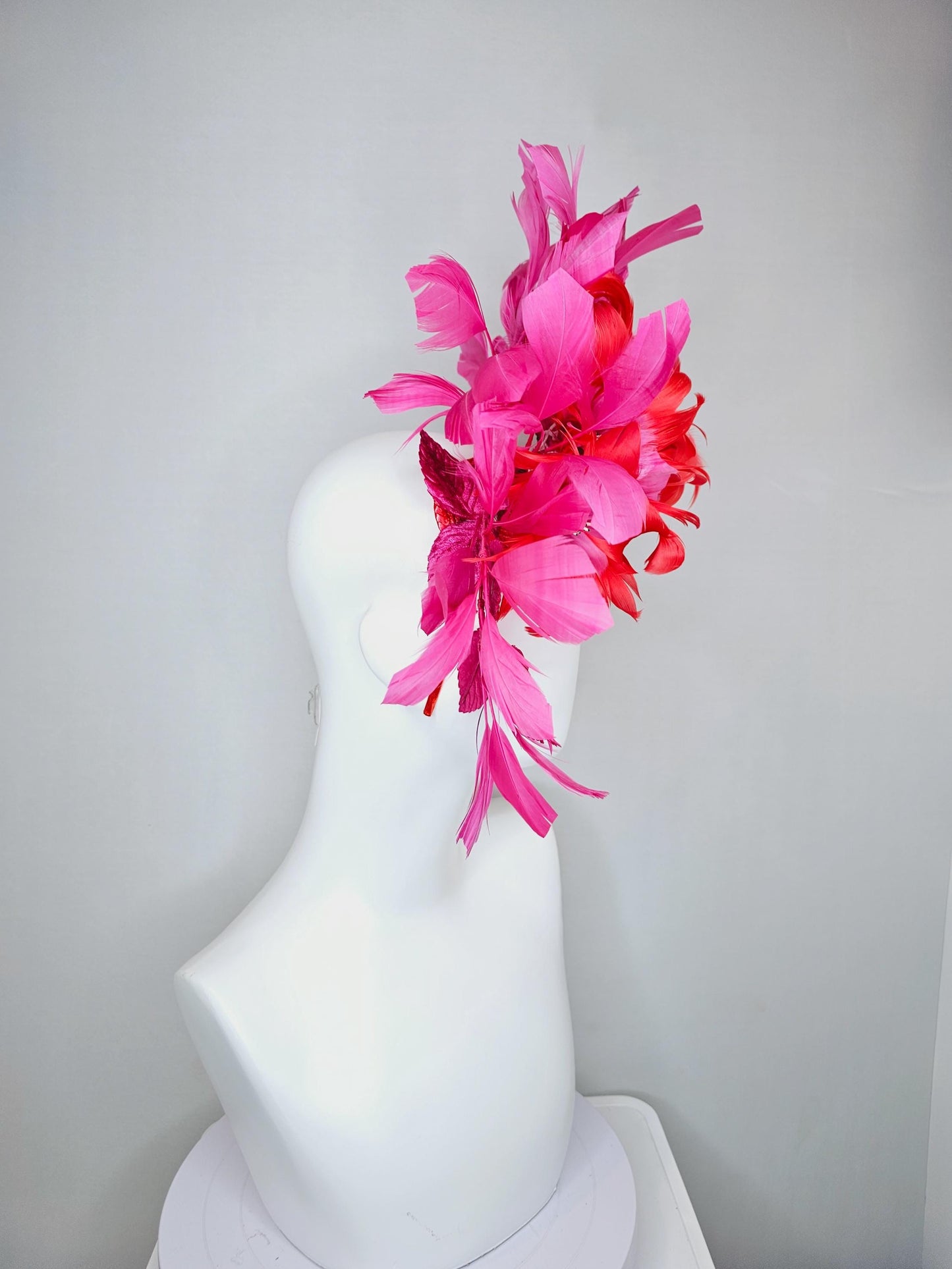 kentucky derby hat fascinator with cherry red feather flowers with blush pink feather cores, pink leaves and pink branching feathers