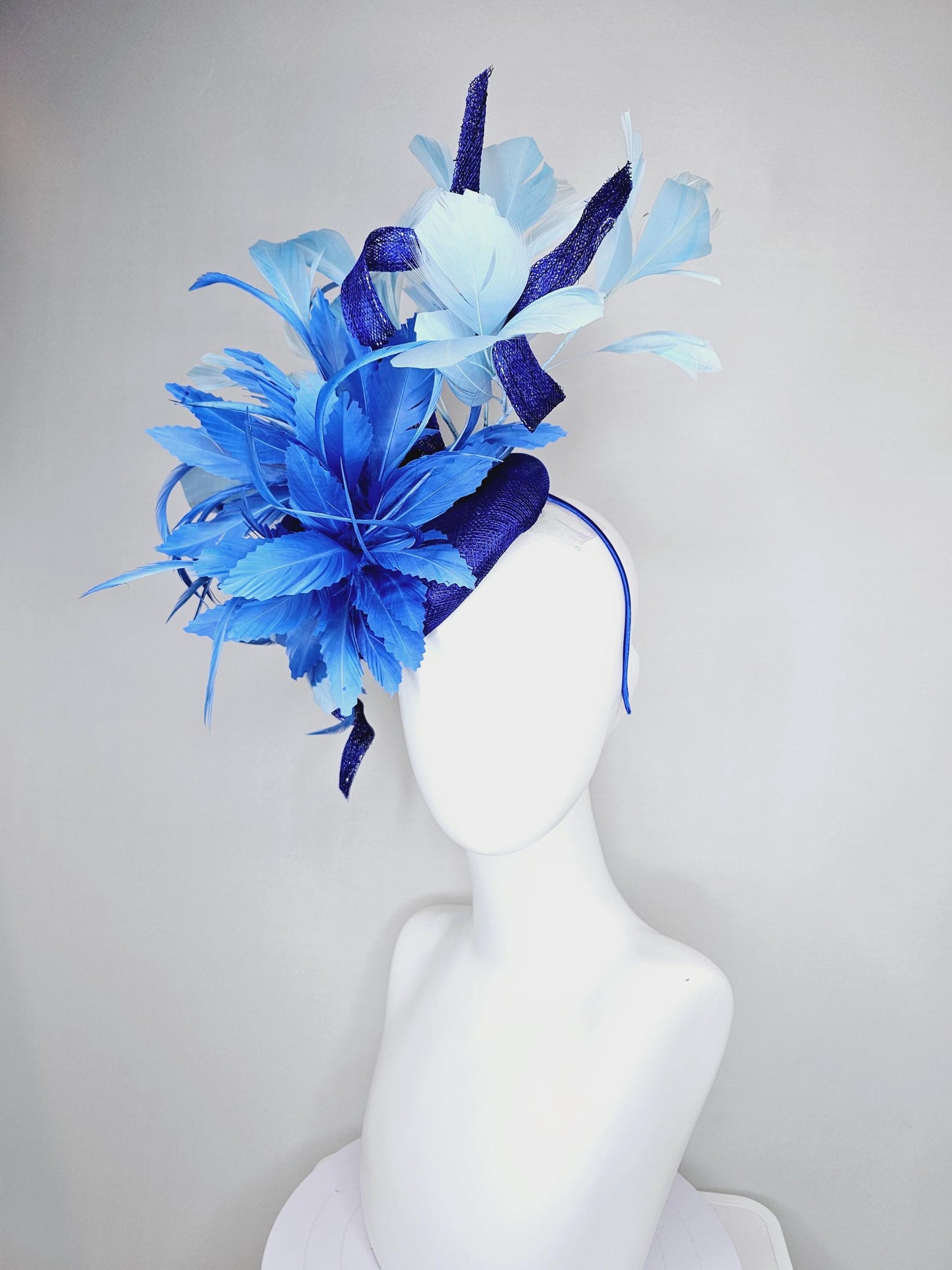 kentucky derby hat fascinator navy blue sinamay, fluffy royal blue zigzag feathers, navy blue sinamay curls, light blue branching feathers