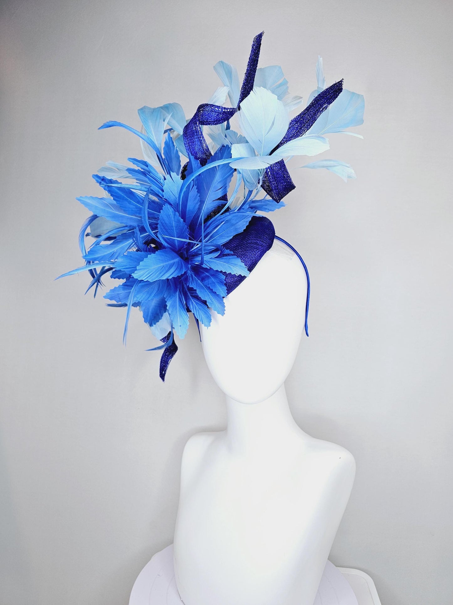 kentucky derby hat fascinator navy blue sinamay, fluffy royal blue zigzag feathers, navy blue sinamay curls, light blue branching feathers