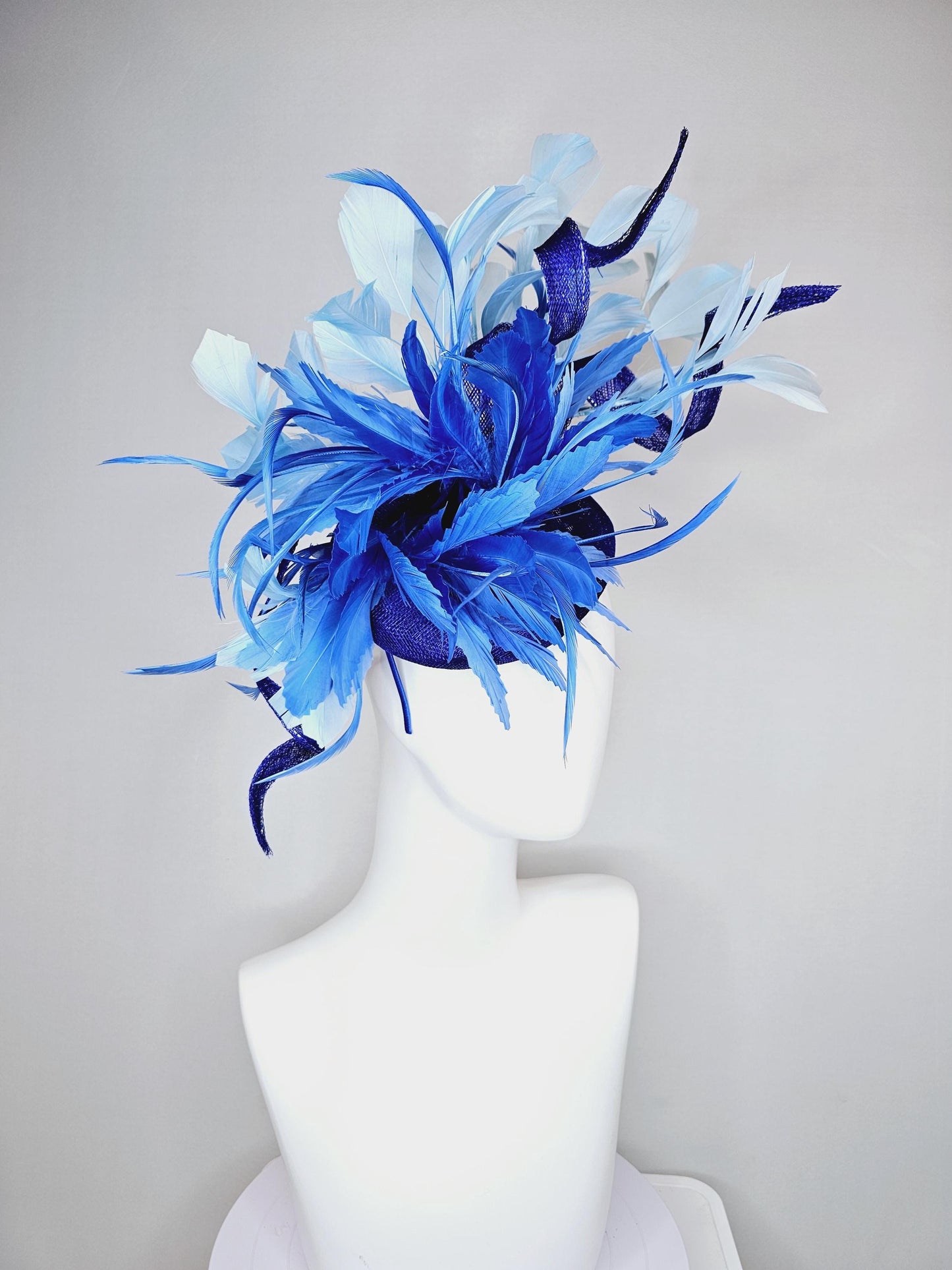 kentucky derby hat fascinator navy blue sinamay, fluffy royal blue zigzag feathers, navy blue sinamay curls, light blue branching feathers