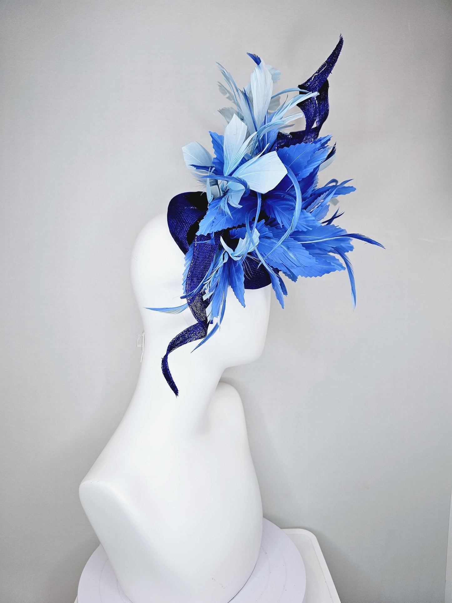 kentucky derby hat fascinator navy blue sinamay, fluffy royal blue zigzag feathers, navy blue sinamay curls, light blue branching feathers