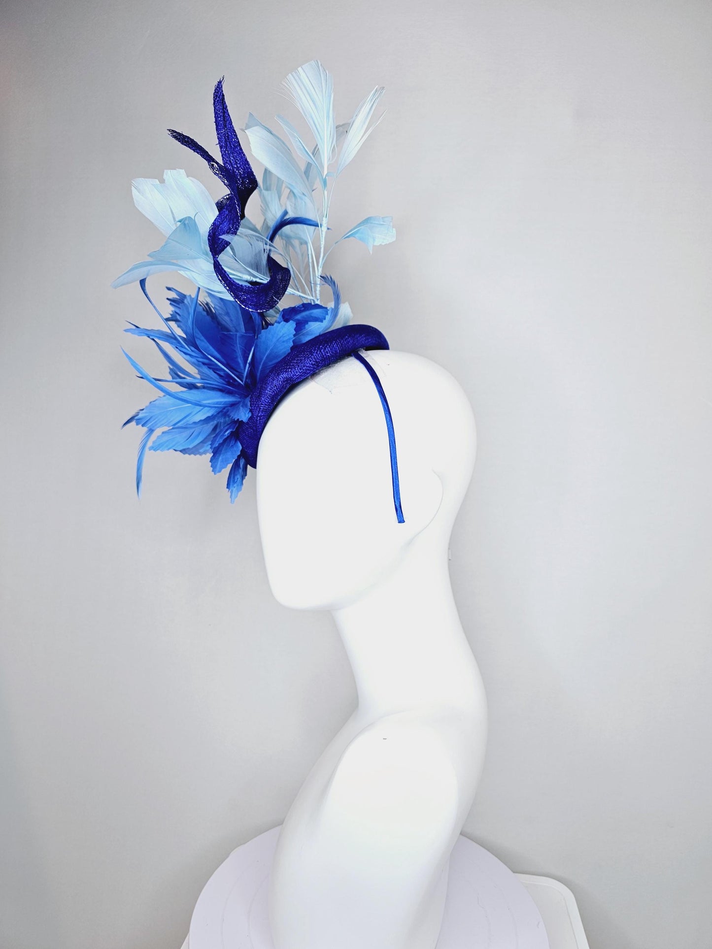 kentucky derby hat fascinator navy blue sinamay, fluffy royal blue zigzag feathers, navy blue sinamay curls, light blue branching feathers