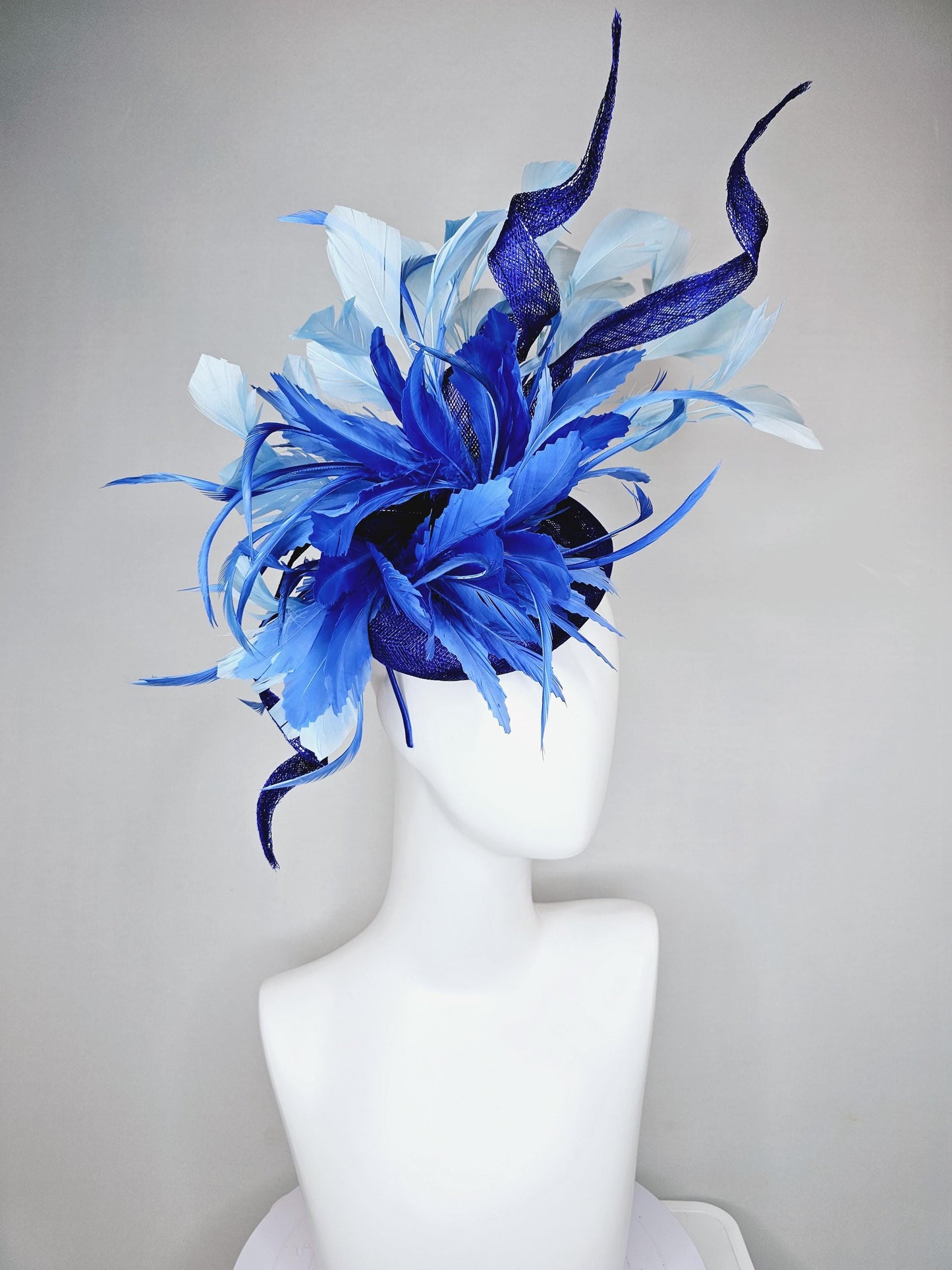 kentucky derby hat fascinator navy blue sinamay, fluffy royal blue zigzag feathers, navy blue sinamay curls, light blue branching feathers