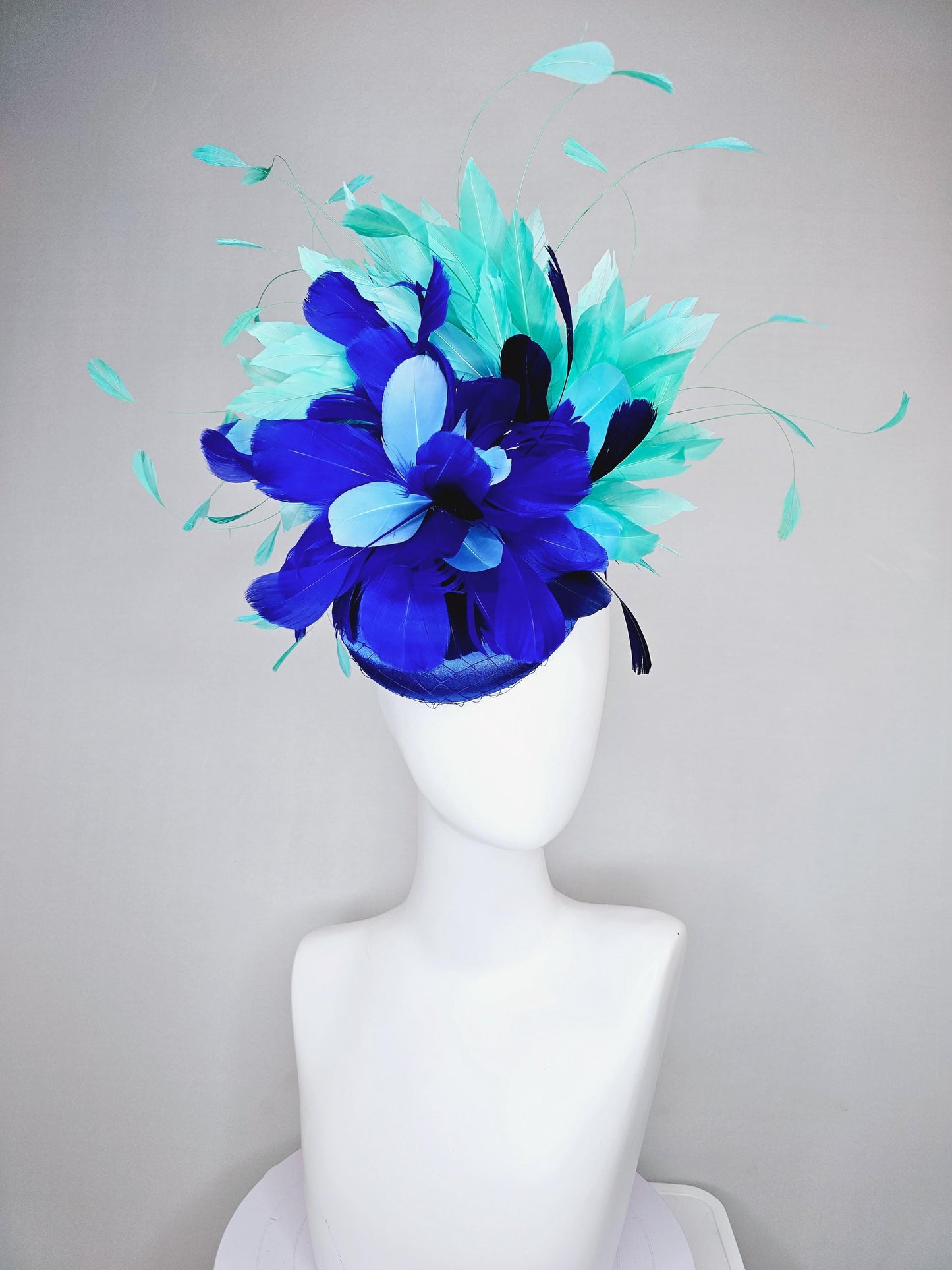 kentucky derby hat fascinator cobalt blue satin with netting and fluffy cobalt blue, light blue,navy blue,aqua blue green branching feathers