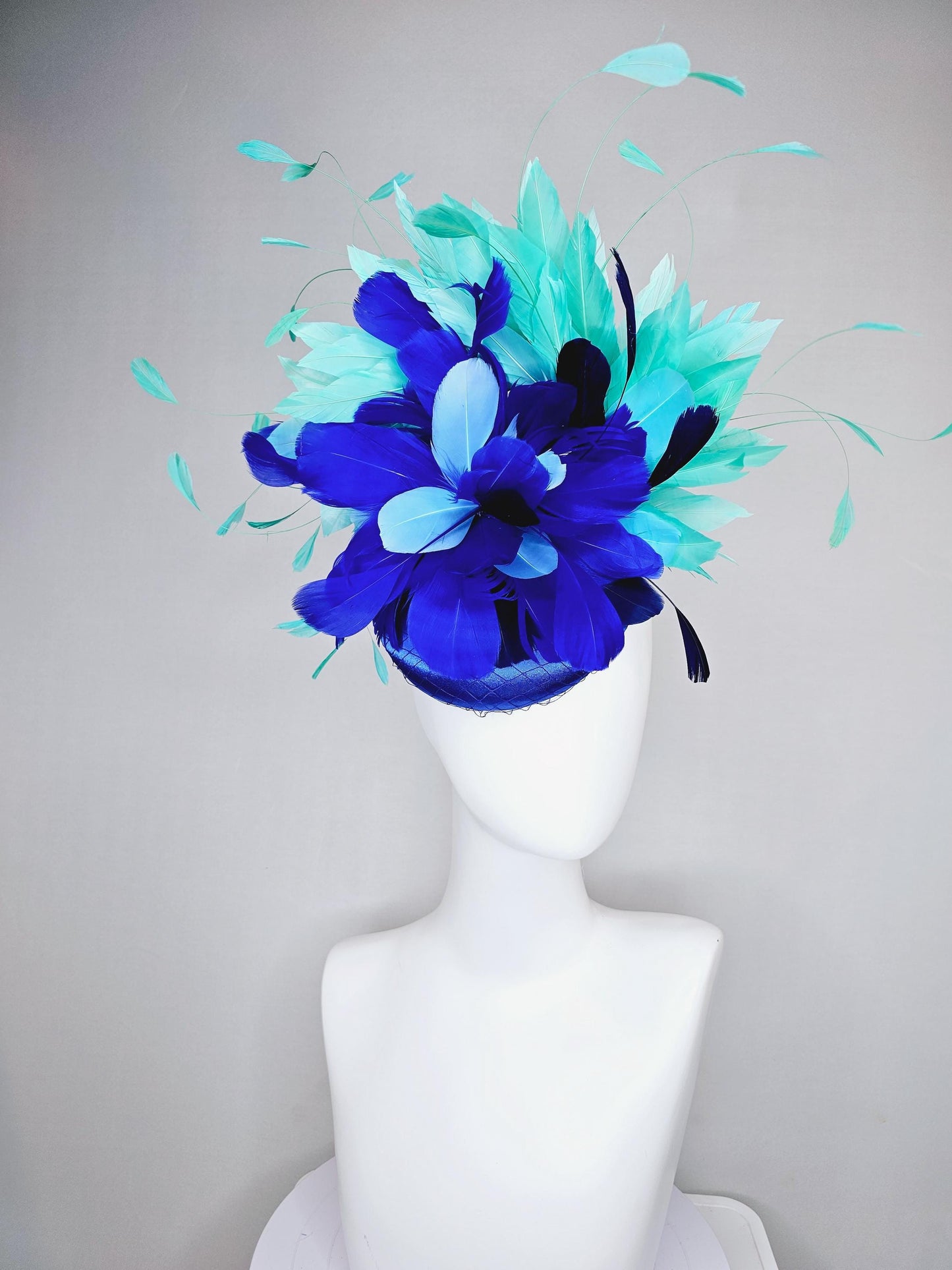 kentucky derby hat fascinator cobalt blue satin with netting and fluffy cobalt blue, light blue,navy blue,aqua blue green branching feathers