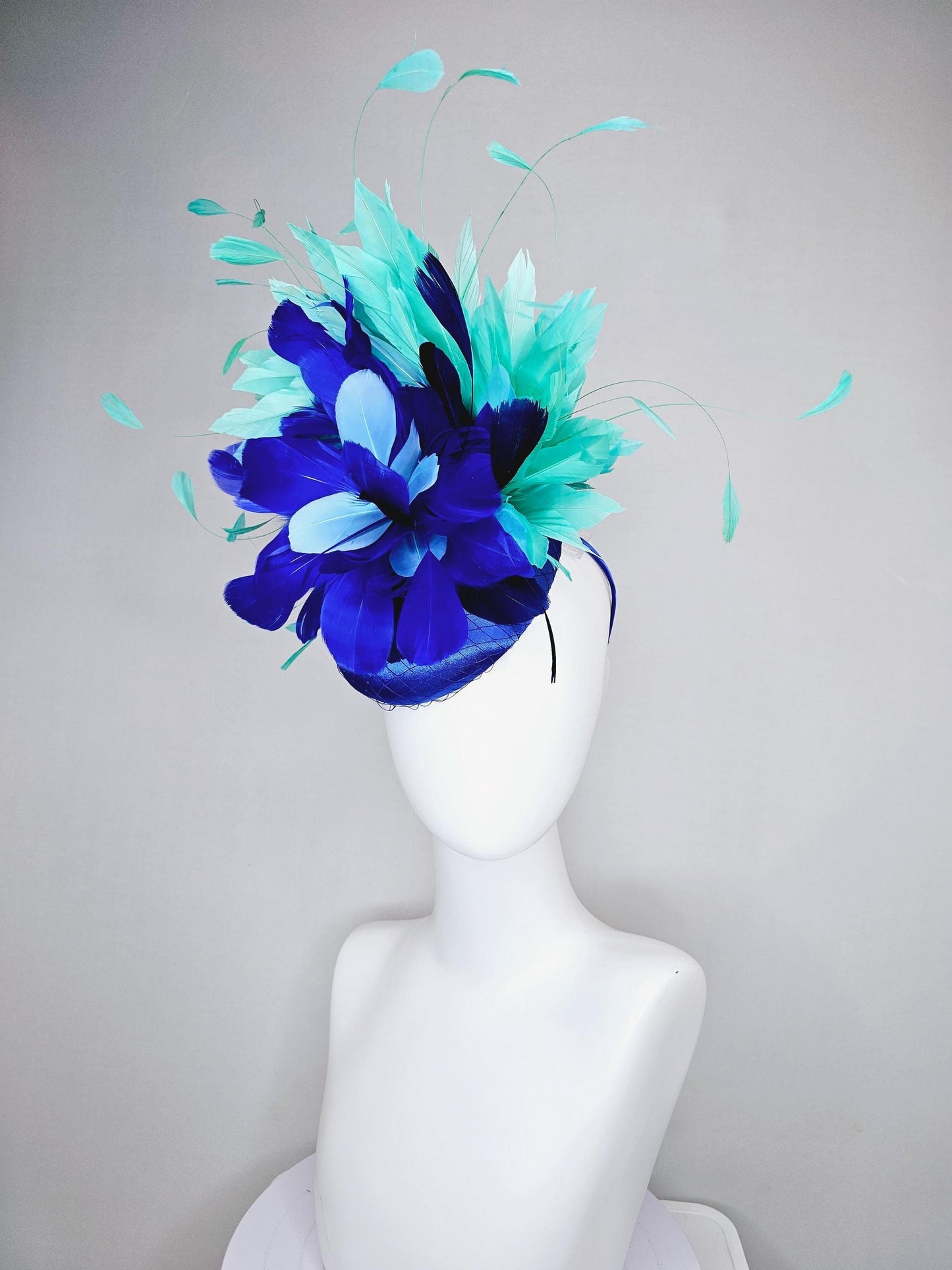 kentucky derby hat fascinator cobalt blue satin with netting and fluffy cobalt blue, light blue,navy blue,aqua blue green branching feathers