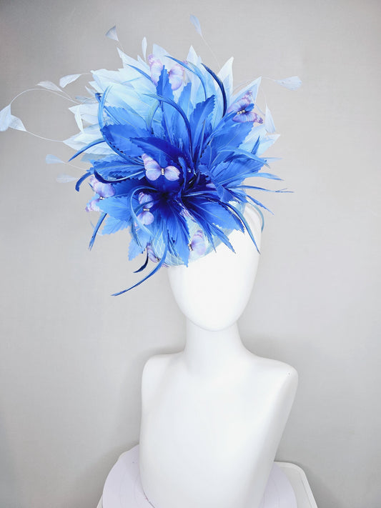 kentucky derby hat fascinator light blue satin with netting, fluffy zigzag royal blue and light blue branching feathers, purple butterflies