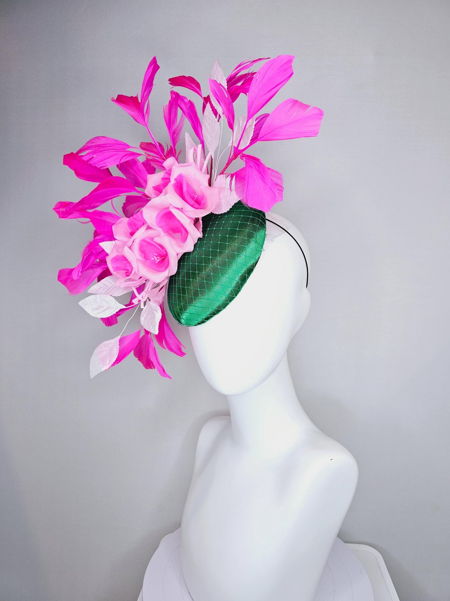 kentucky derby hat fascinator green satin with netting, blush pink satin flowers, light pink leaves, bright pink fuchsia branching feathers