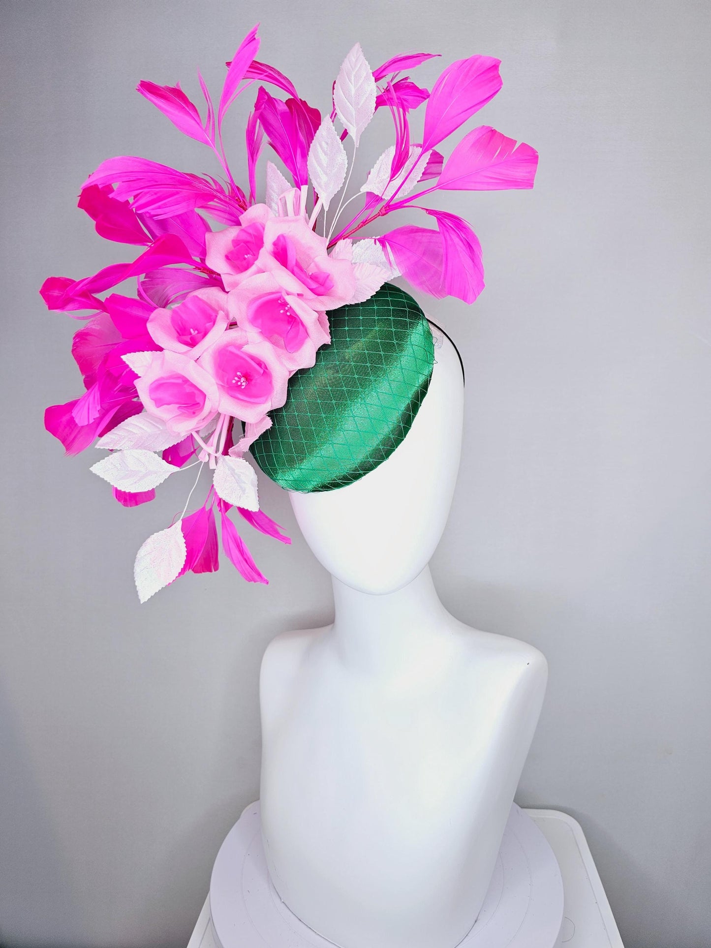 kentucky derby hat fascinator green satin with netting, blush pink satin flowers, light pink leaves, bright pink fuchsia branching feathers