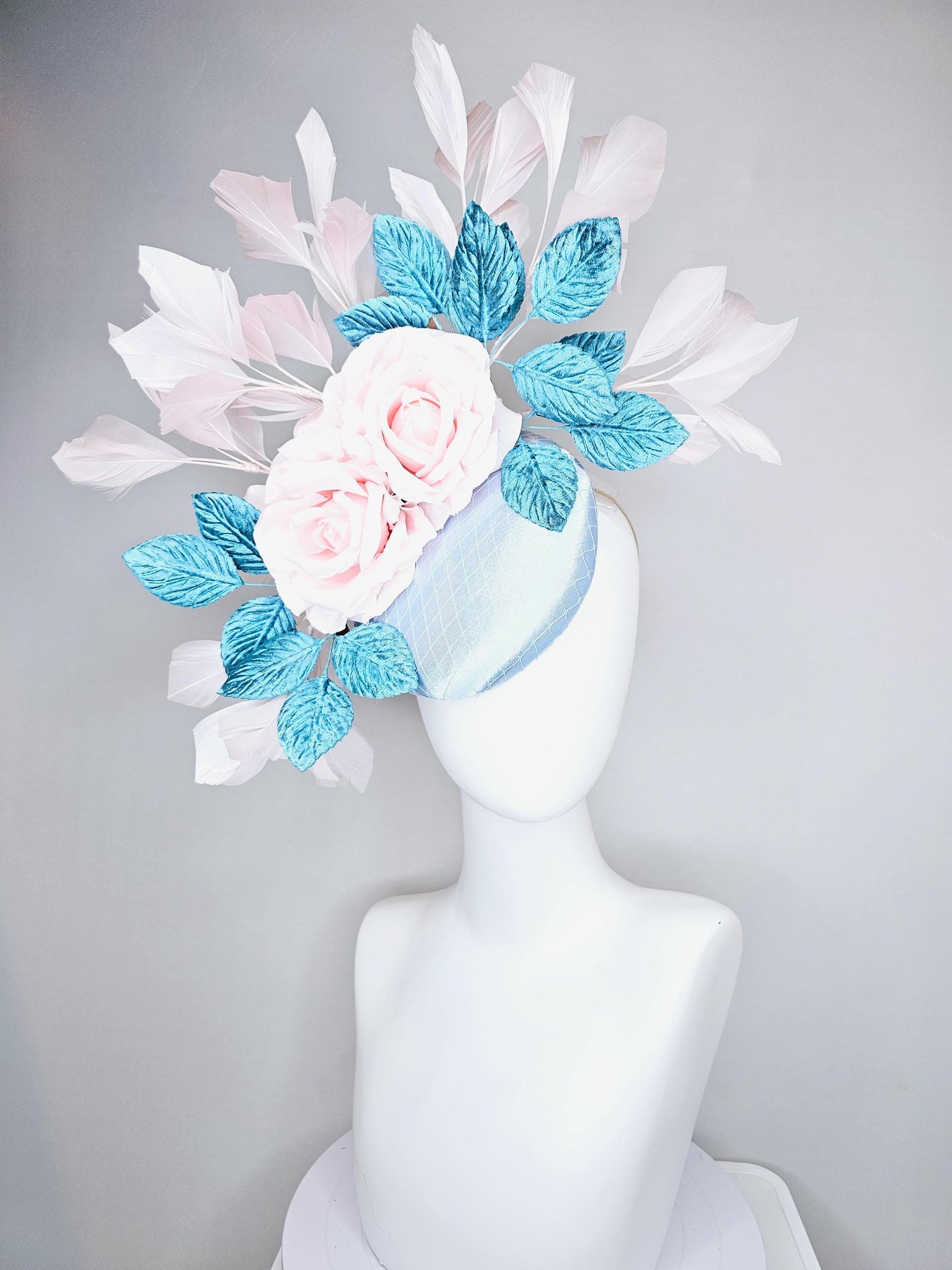 kentucky derby hat fascinator light blue satin with netting, light pink satin rose flowers, blue leaves, light pink branching feathers