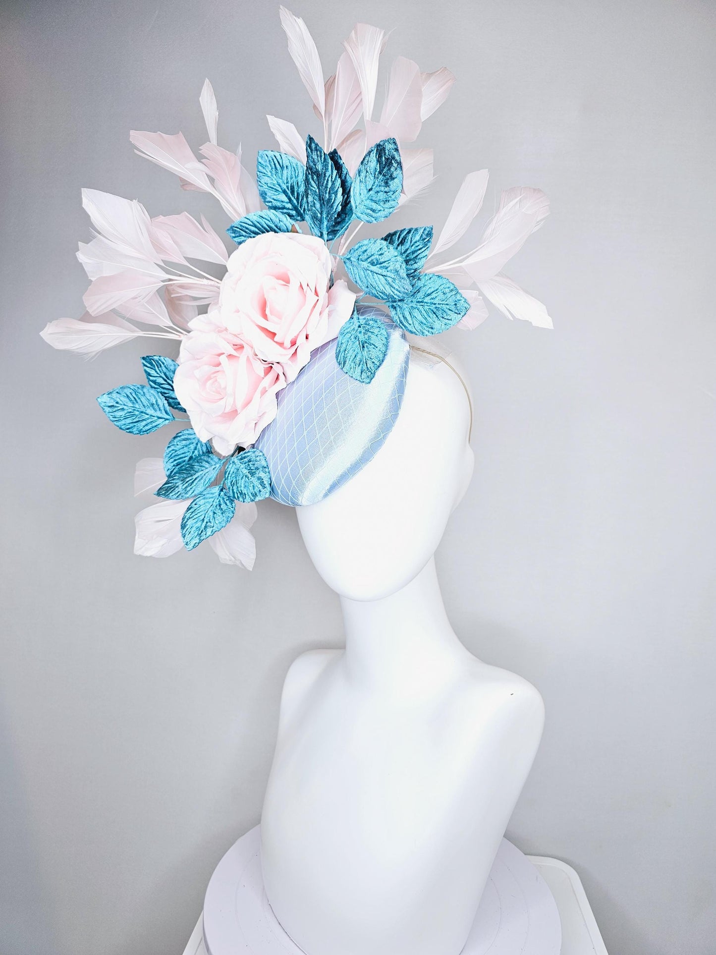 kentucky derby hat fascinator light blue satin with netting, light pink satin rose flowers, blue leaves, light pink branching feathers