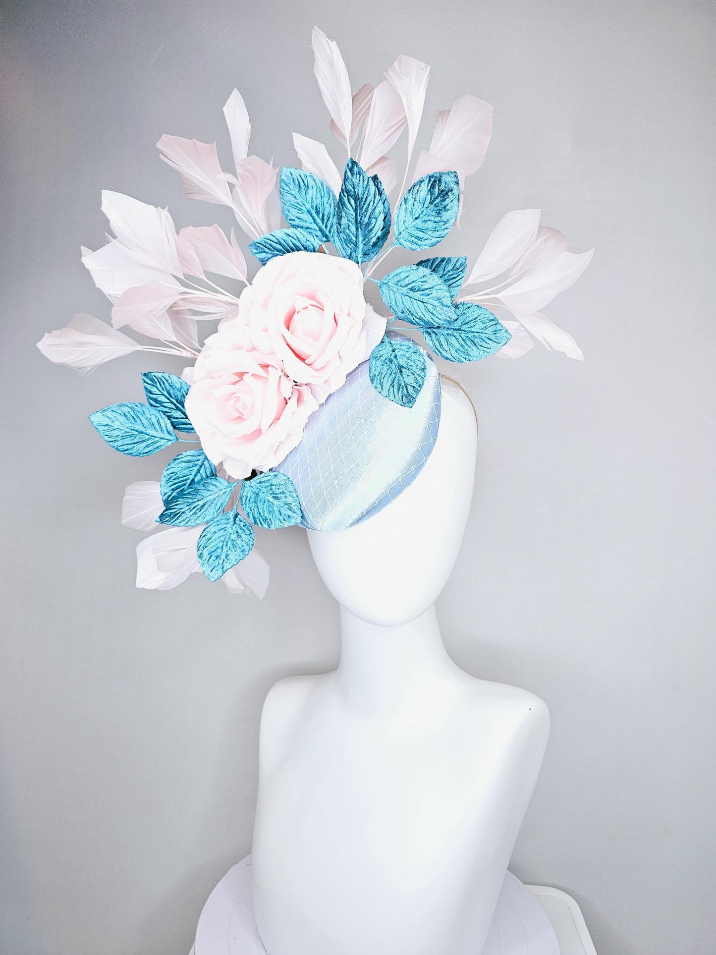 kentucky derby hat fascinator light blue satin with netting, light pink satin rose flowers, blue leaves, light pink branching feathers