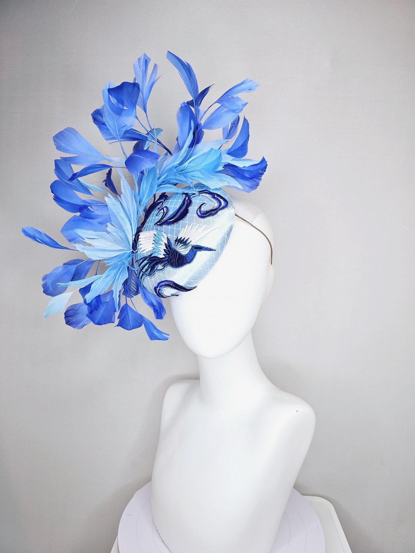 kentucky derby hat fascinator light blue satin with netting embroidered white blue birds, sky blue royal blue cobalt blue branching feathers