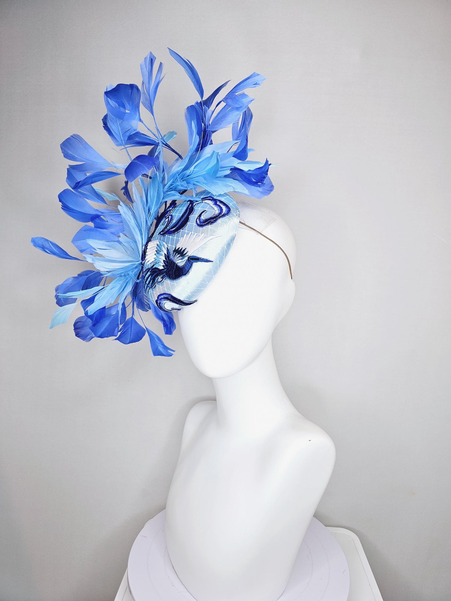 kentucky derby hat fascinator light blue satin with netting embroidered white blue birds, sky blue royal blue cobalt blue branching feathers