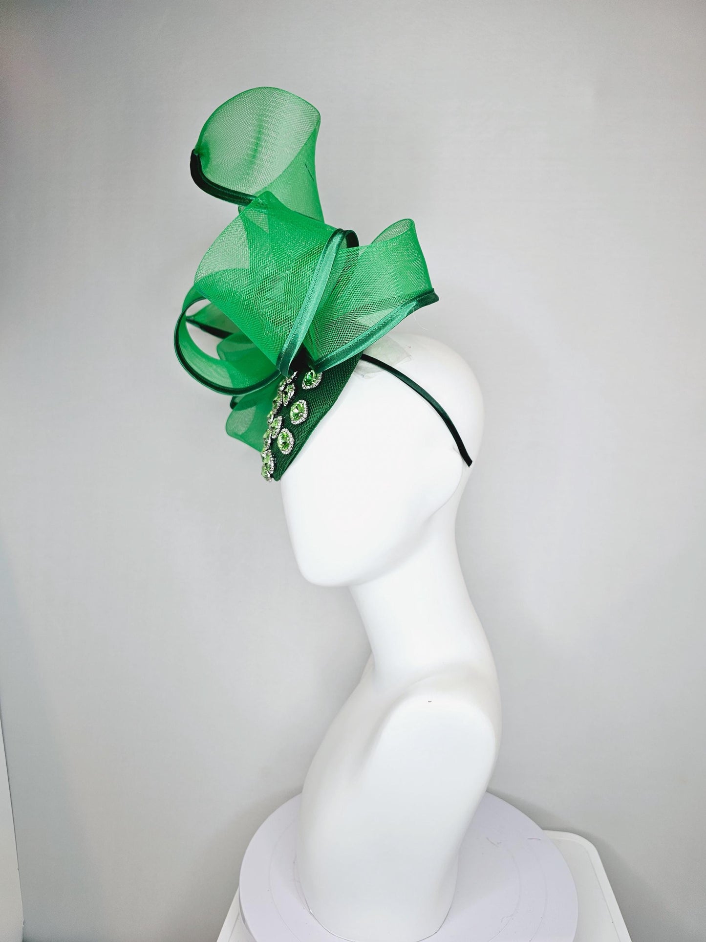 kentucky derby hat fascinator green sinamay with green crystal jewels, emerald green mesh and wired ribbon large bendable bow decor