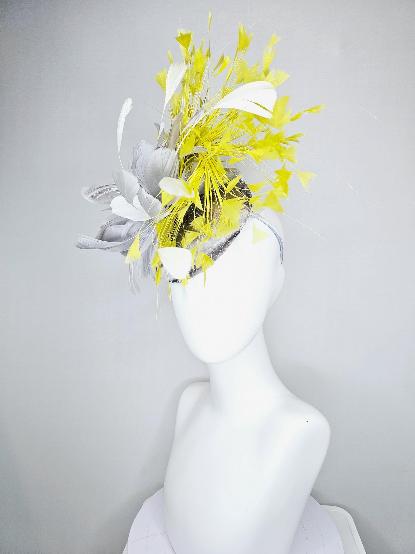 kentucky derby hat fascinator silver gray satin with netting and silver gray, mustard yellow branching feathers