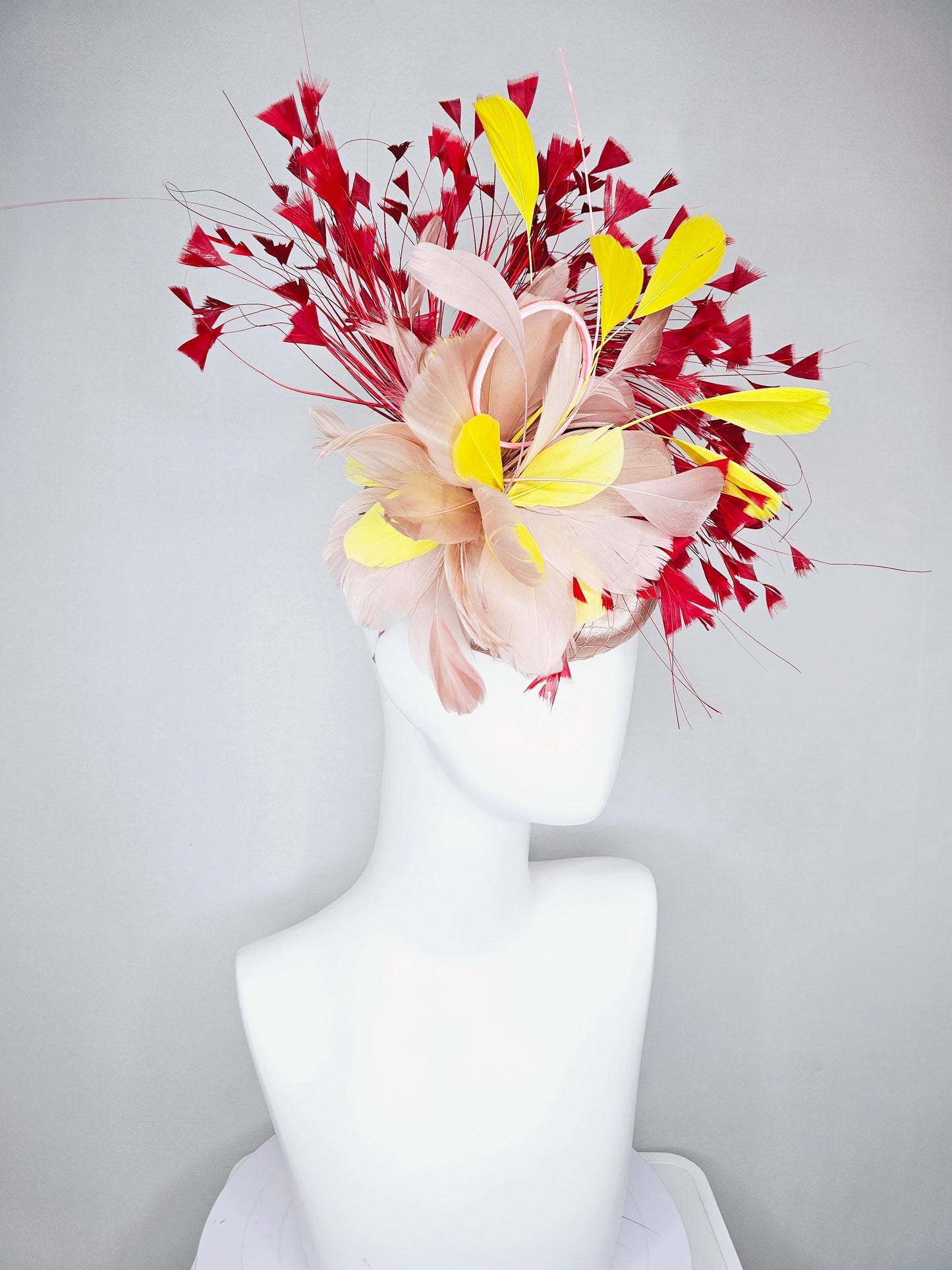 kentucky derby hat fascinator neutral beige pink satin with netting and fluffy neutral beige pink, yellow, scarlet red branching feathers