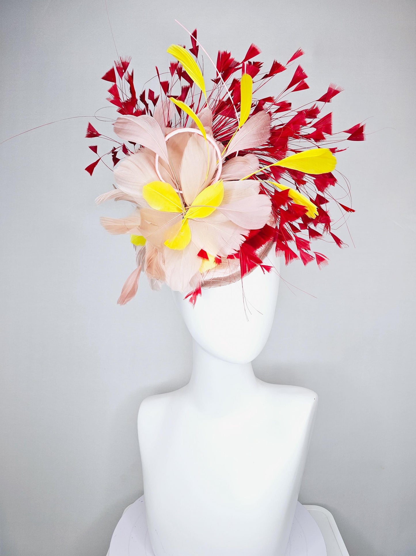 kentucky derby hat fascinator neutral beige pink satin with netting and fluffy neutral beige pink, yellow, scarlet red branching feathers