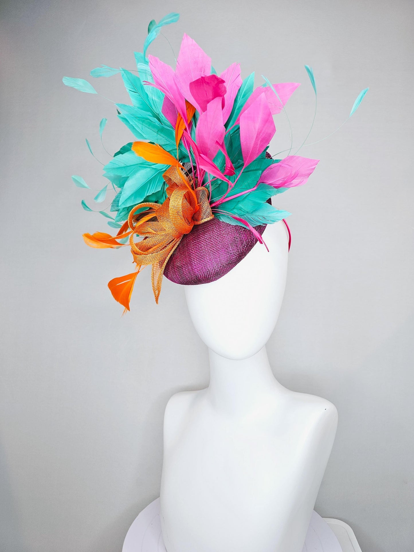 kentucky derby hat fascinator magenta purple sinamay with orange sinamay bow and orange feathers,pink and aqua blue green branching feathers