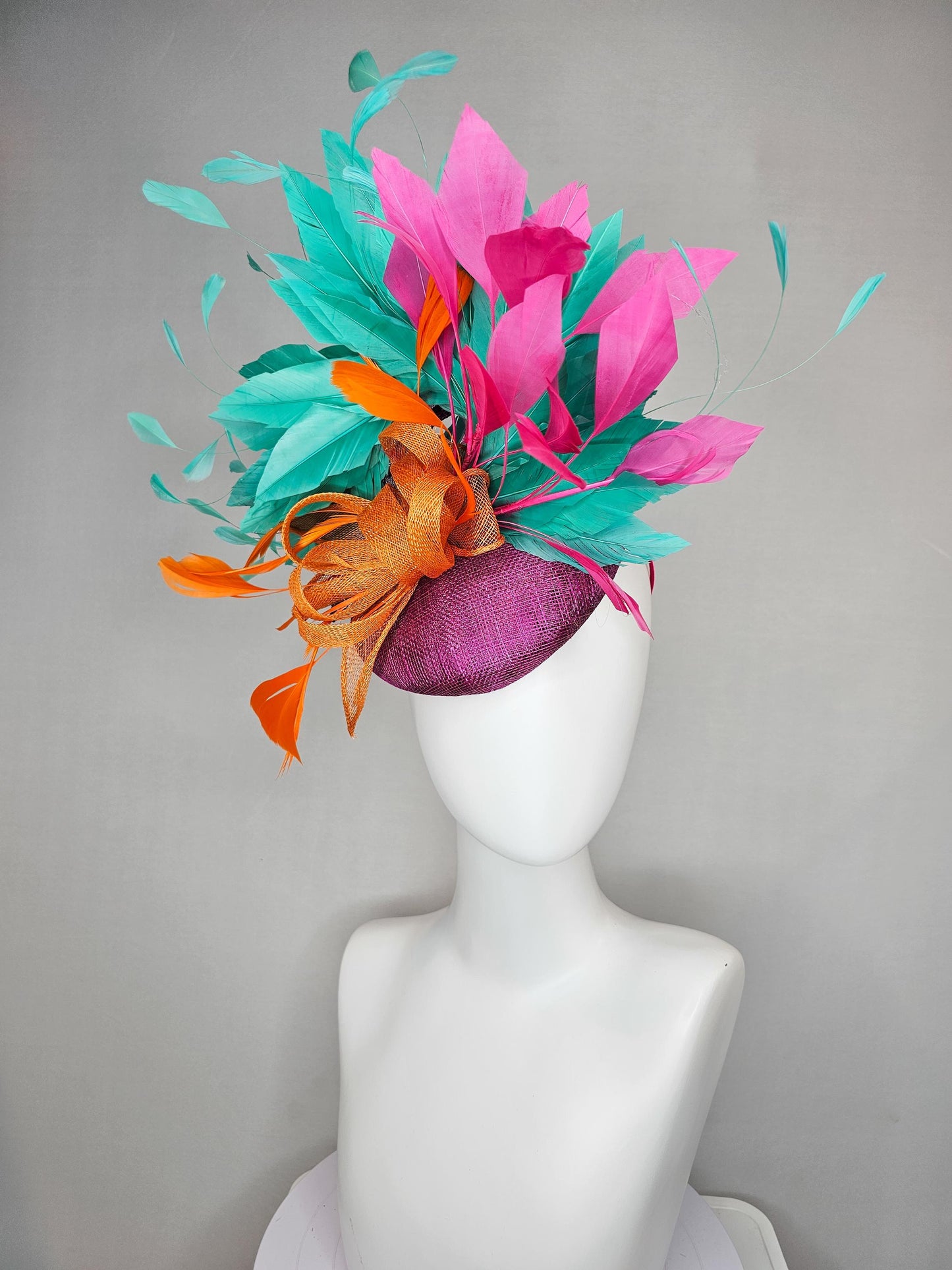 kentucky derby hat fascinator magenta purple sinamay with orange sinamay bow and orange feathers,pink and aqua blue green branching feathers