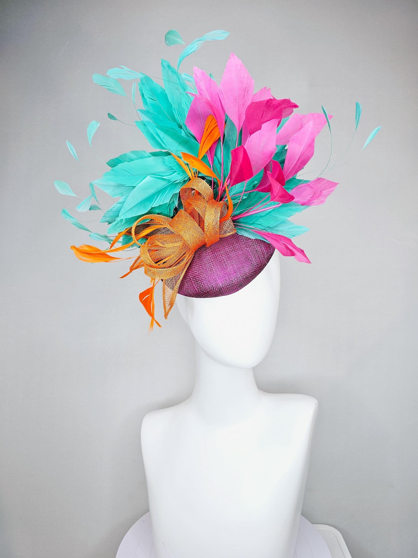 kentucky derby hat fascinator magenta purple sinamay with orange sinamay bow and orange feathers,pink and aqua blue green branching feathers