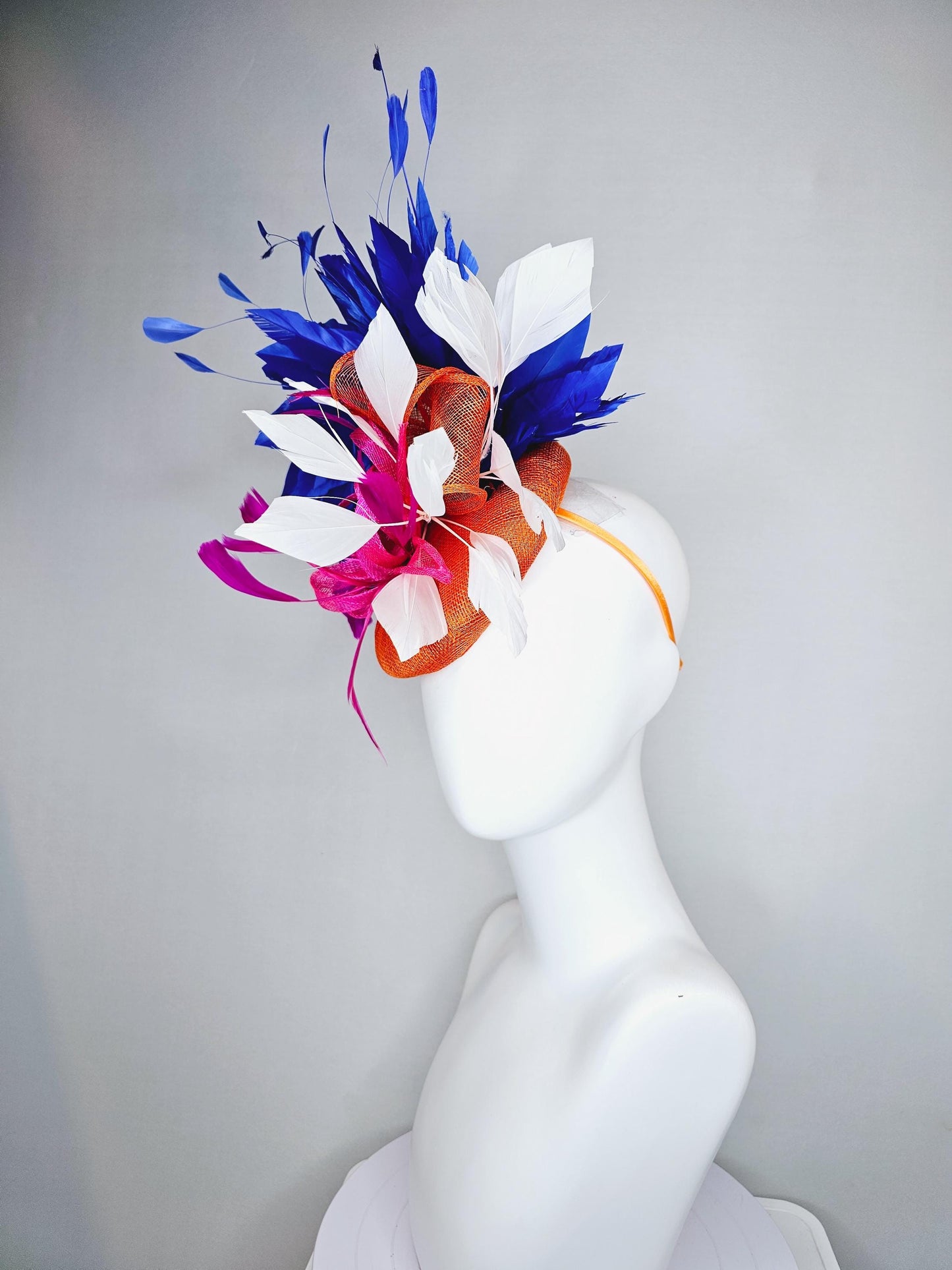 kentucky derby hat fascinator orange sinamay with pink and orange sinamay bow and pink feathers, white and royal blue branching feathers