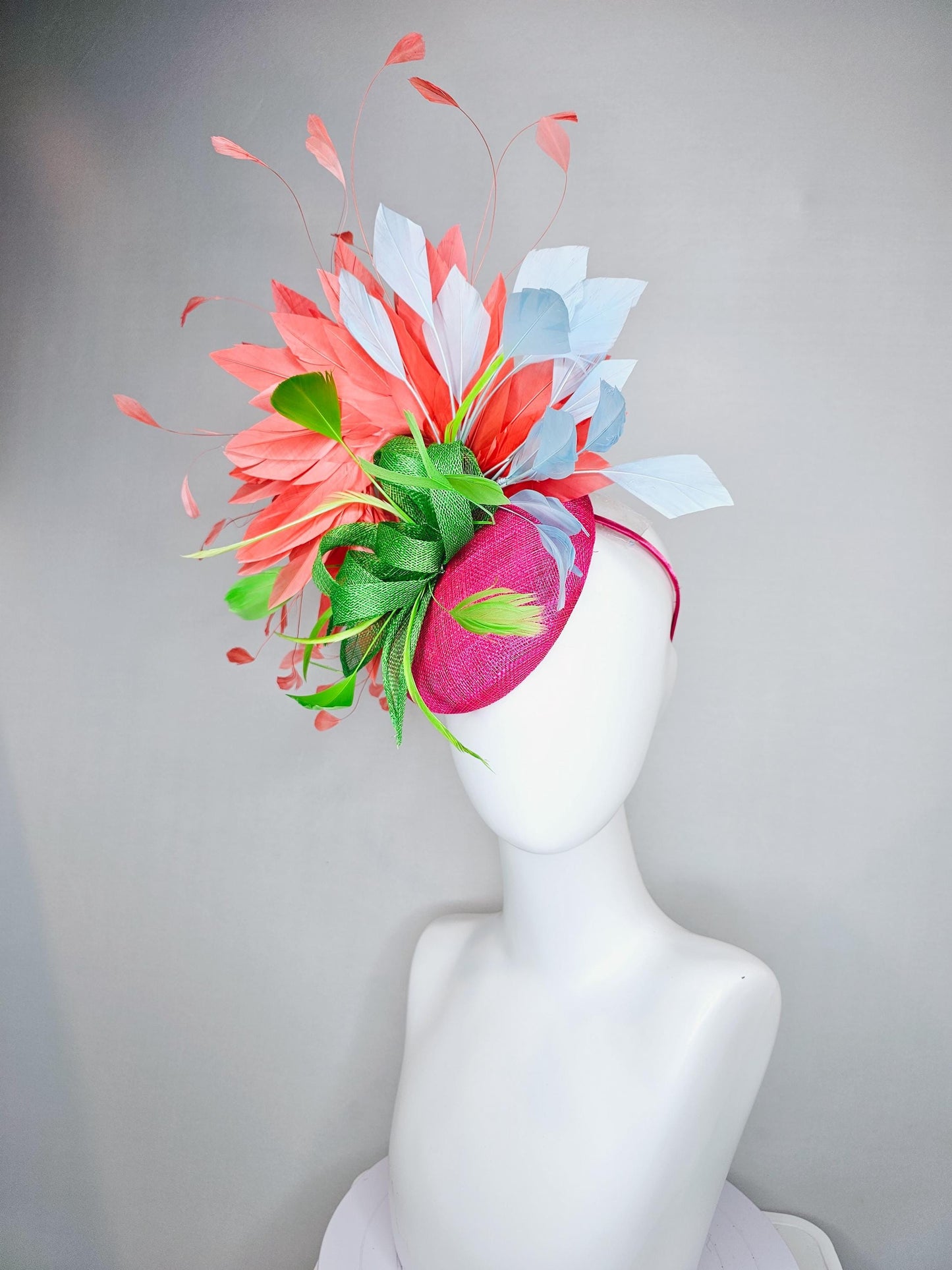 kentucky derby hat fascinator pink sinamay with green sinamay bow and lime green feathers, light blue and coral orange branching feathers