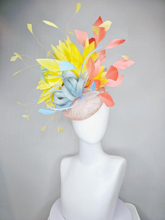 kentucky derby hat fascinator light pink sinamay with light blue sinamay bow and blue feathers, coral orange and yellow branching feathers