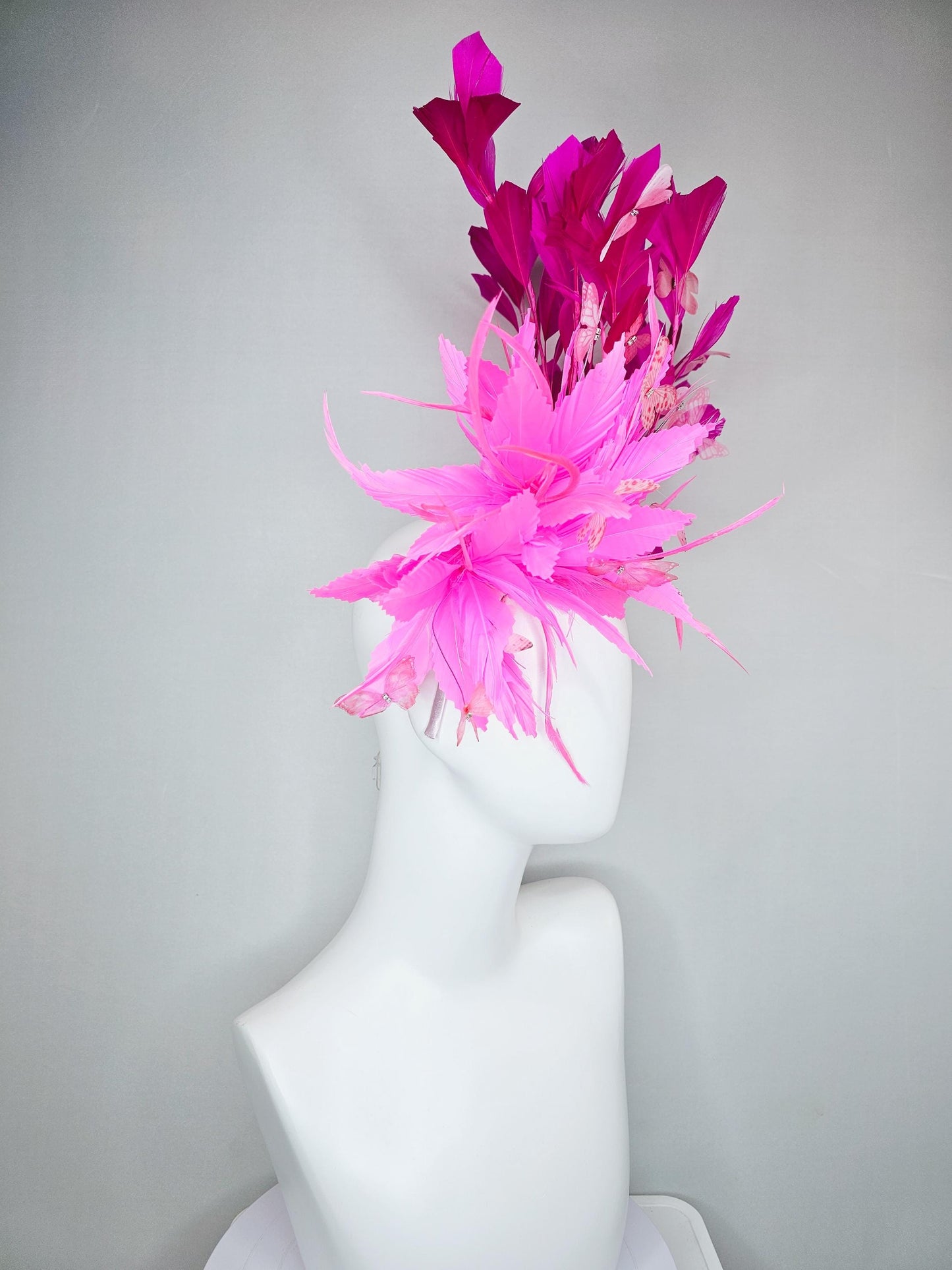 kentucky derby hat fascinator with fluffy pink zigzag feather, bright fuchsia pink branching feathers and pink butterflies