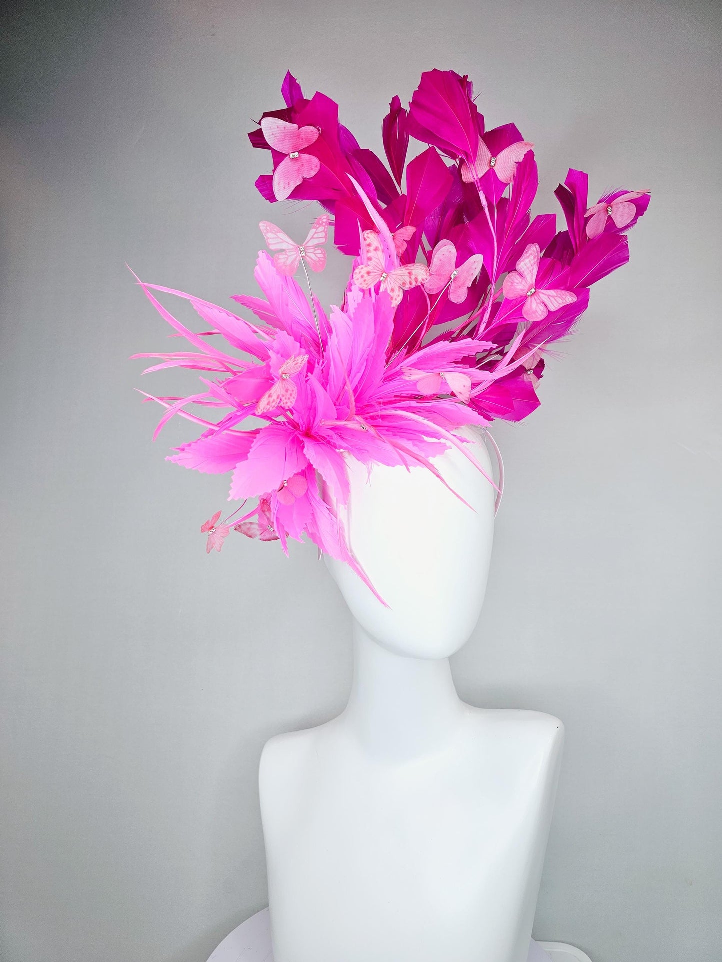 kentucky derby hat fascinator with fluffy pink zigzag feather, bright fuchsia pink branching feathers and pink butterflies