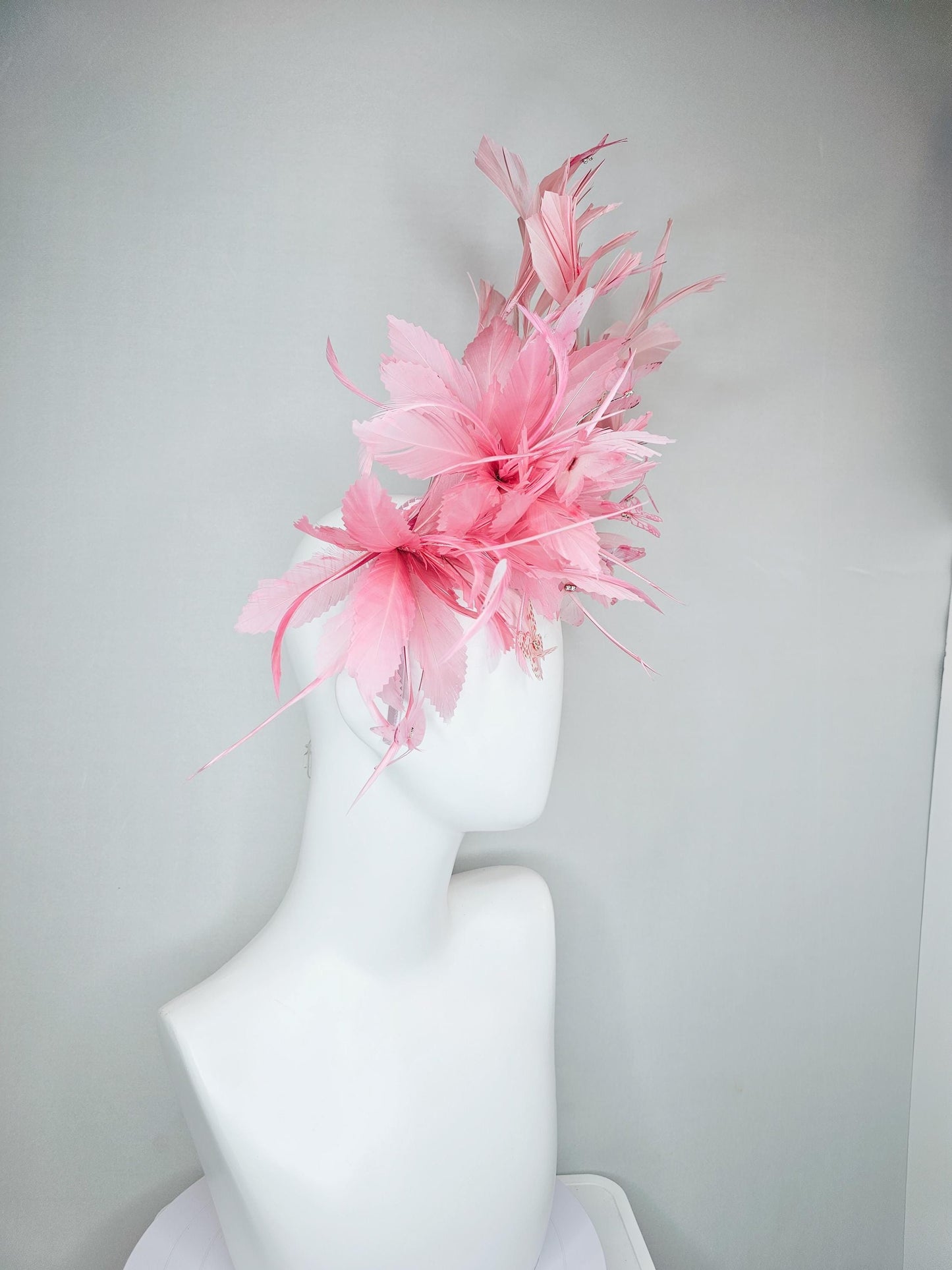 kentucky derby hat fascinator with fluffy light blush pink zigzag feather, light blush pink branching feathers, light blush pink butterflies