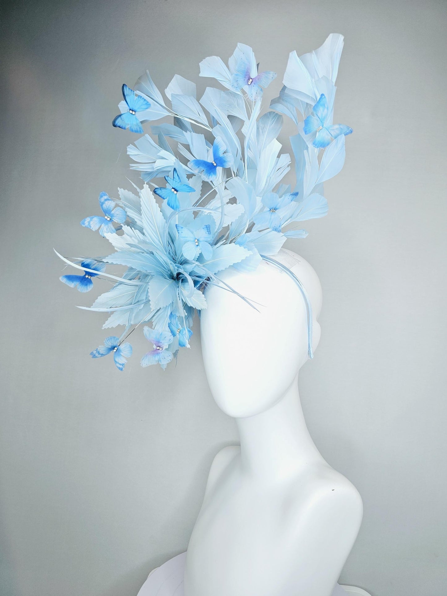 kentucky derby hat fascinator with fluffy light baby blue zigzag feathers, light baby blue branching feathers, light sky blue butterflies