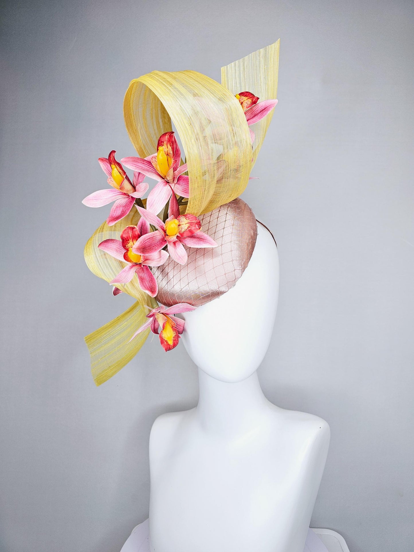 kentucky derby hat fascinator light pink satin with netting, ombre red and yellow orchid flowers, yellow silk ribbon large bendable decor