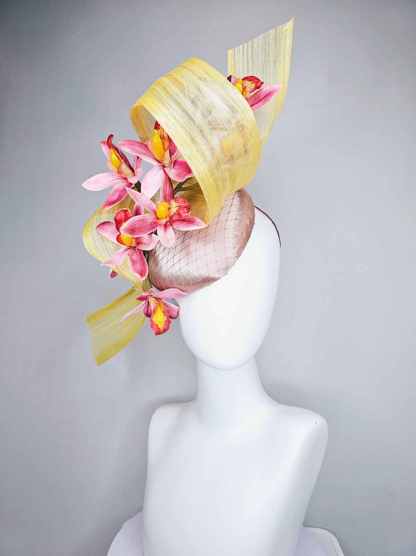 kentucky derby hat fascinator light pink satin with netting, ombre red and yellow orchid flowers, yellow silk ribbon large bendable decor