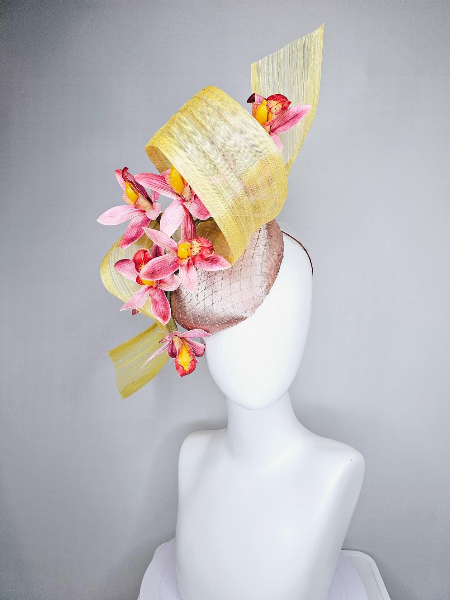 kentucky derby hat fascinator light pink satin with netting, ombre red and yellow orchid flowers, yellow silk ribbon large bendable decor