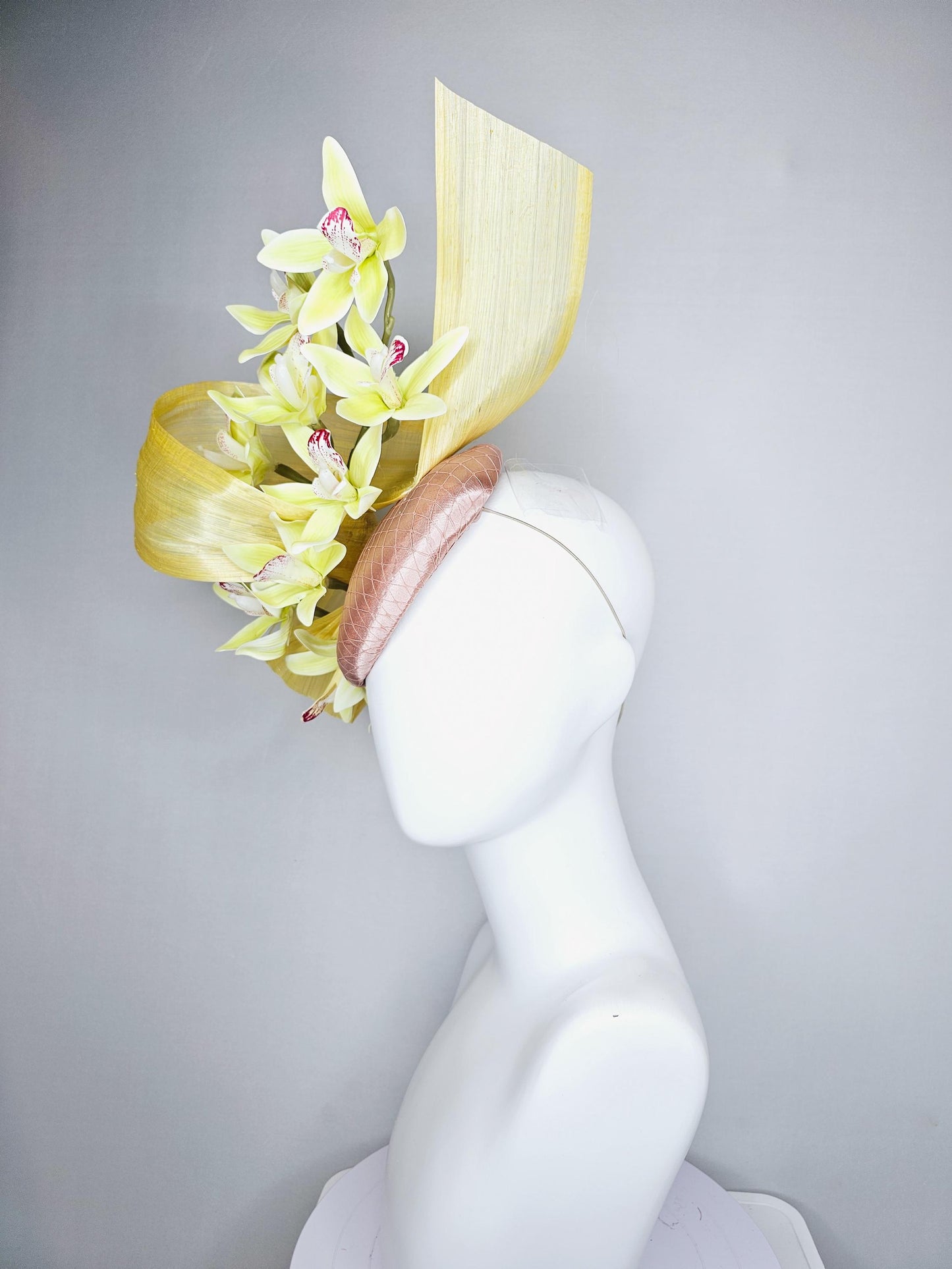 kentucky derby hat fascinator light pink satin with netting, yellow and wine red orchid flowers, yellow silk ribbon large bendable decor