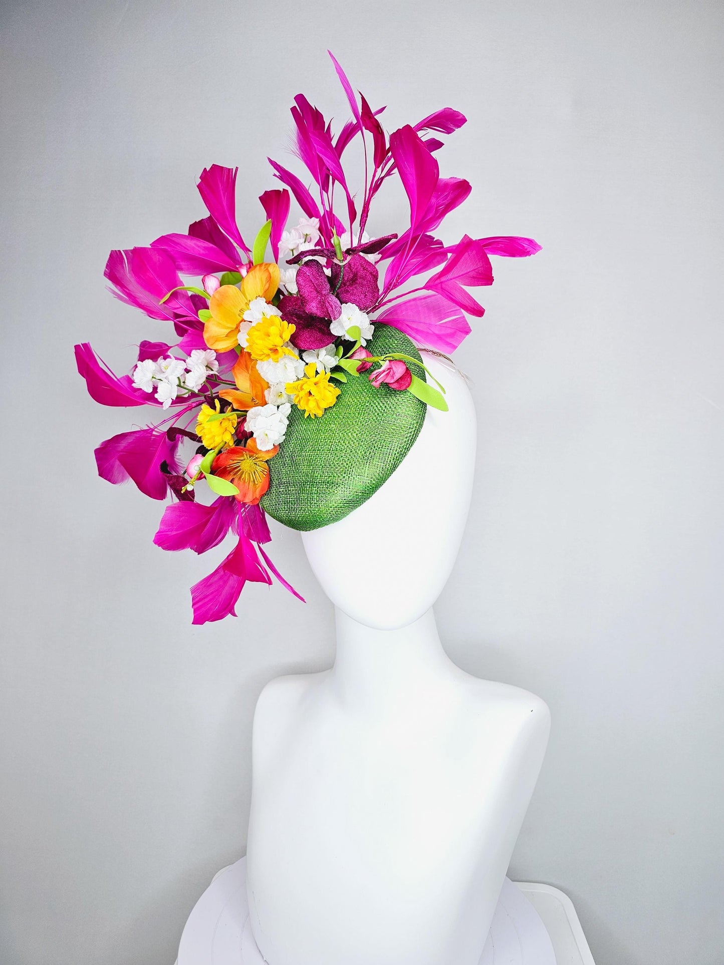 kentucky derby hat fascinator lime green sinamay with yellow orange white pink satin flowers, green leaves, fuchsia pink branching feathers