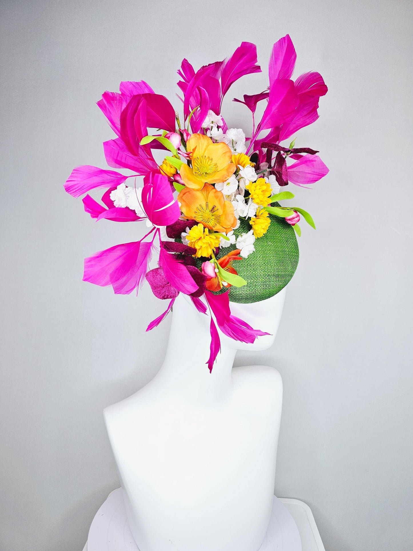 kentucky derby hat fascinator lime green sinamay with yellow orange white pink satin flowers, green leaves, fuchsia pink branching feathers